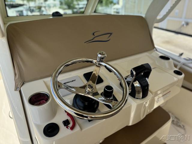 2022 Scout 330 LXF boat helm with steering wheel and controls.