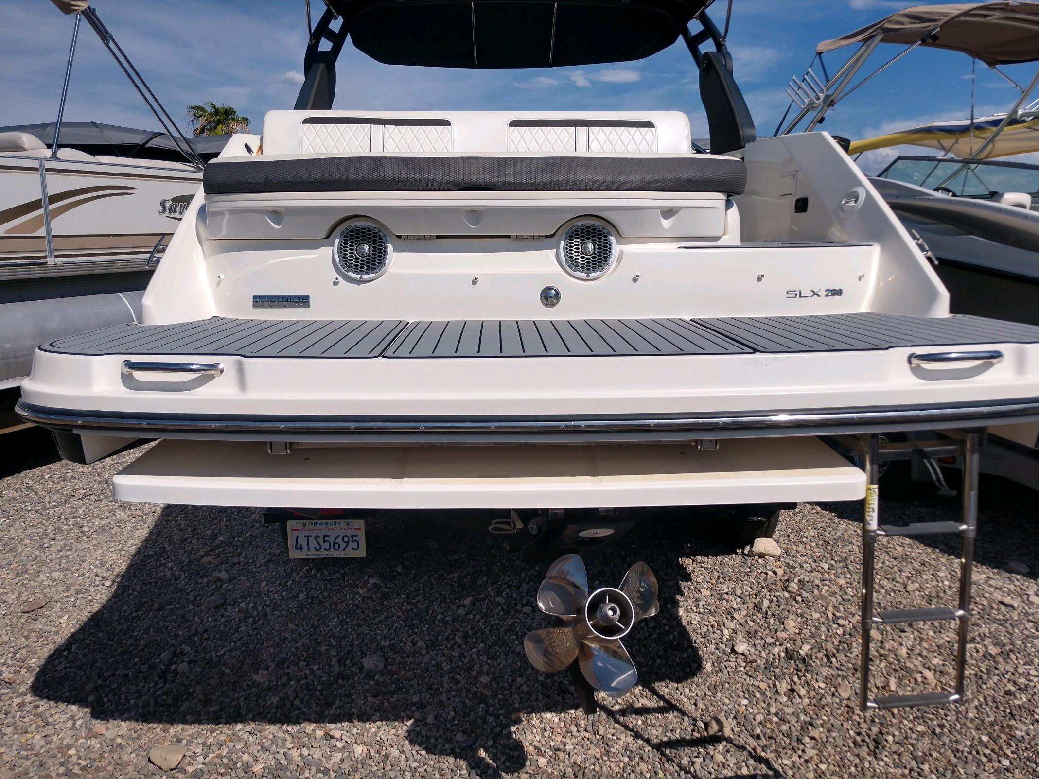 2018 Sea Ray SLX 280 boat rear view with swim platform and ladder.