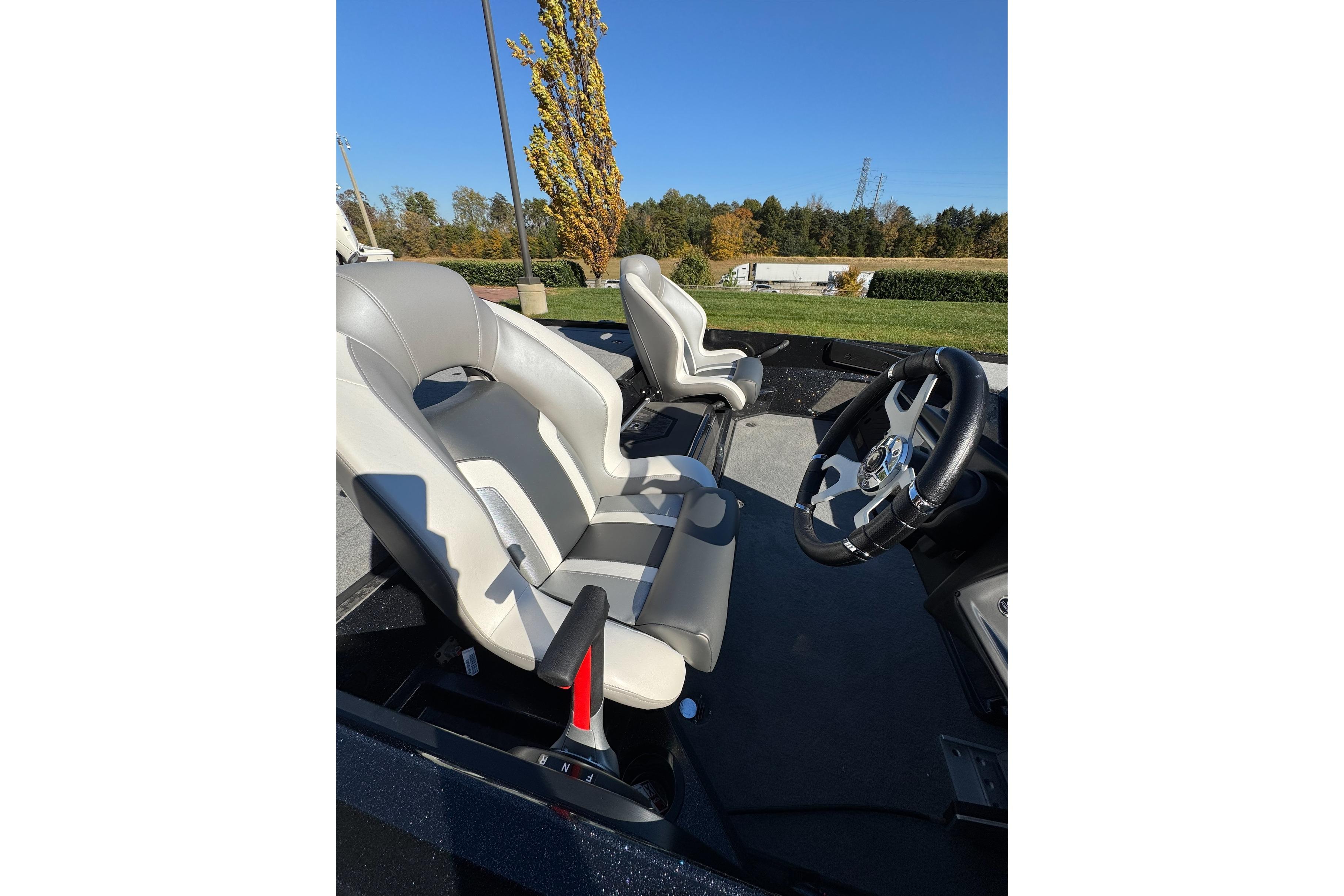 Interior of 2026 Nitro Z20 XL Pro boat with sleek seats and steering wheel.