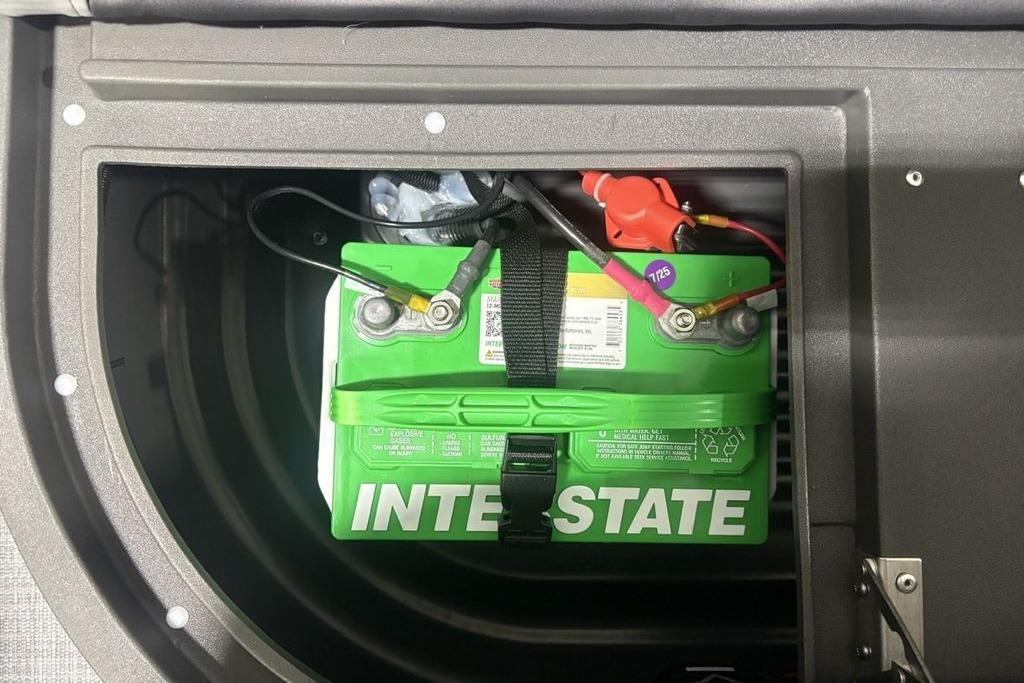 Battery compartment of 2026 Sun Tracker Party Barge 16 DLX with Interstate battery.