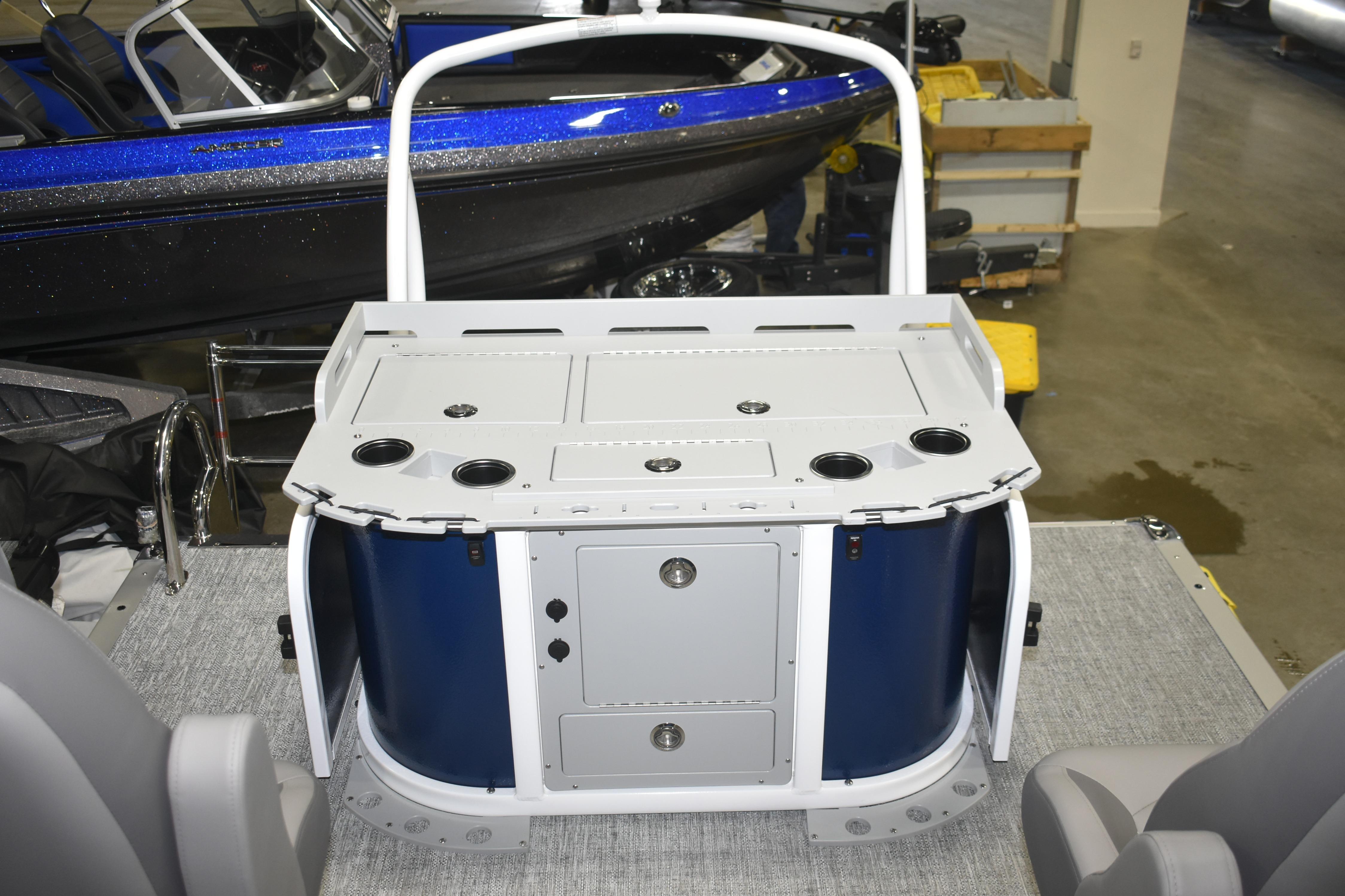 2026 Premier 230 Sunsation Angler 4PT PTX boat interior with fishing station and storage compartments.
