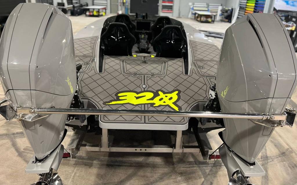 HellKats 320X 2021 model with dual outboard motors in a workshop.