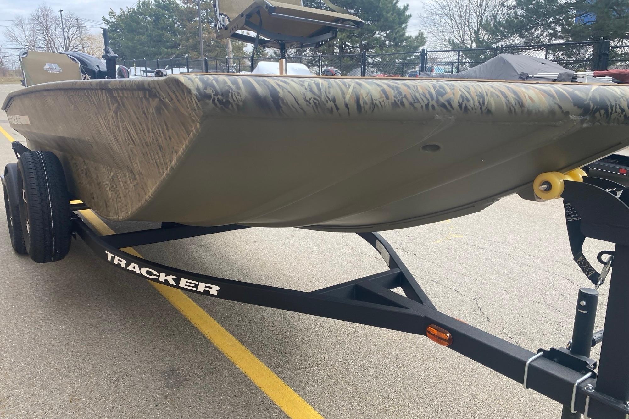 2026 Tracker Grizzly 1756 T Marsh boat on trailer, parked outdoors.