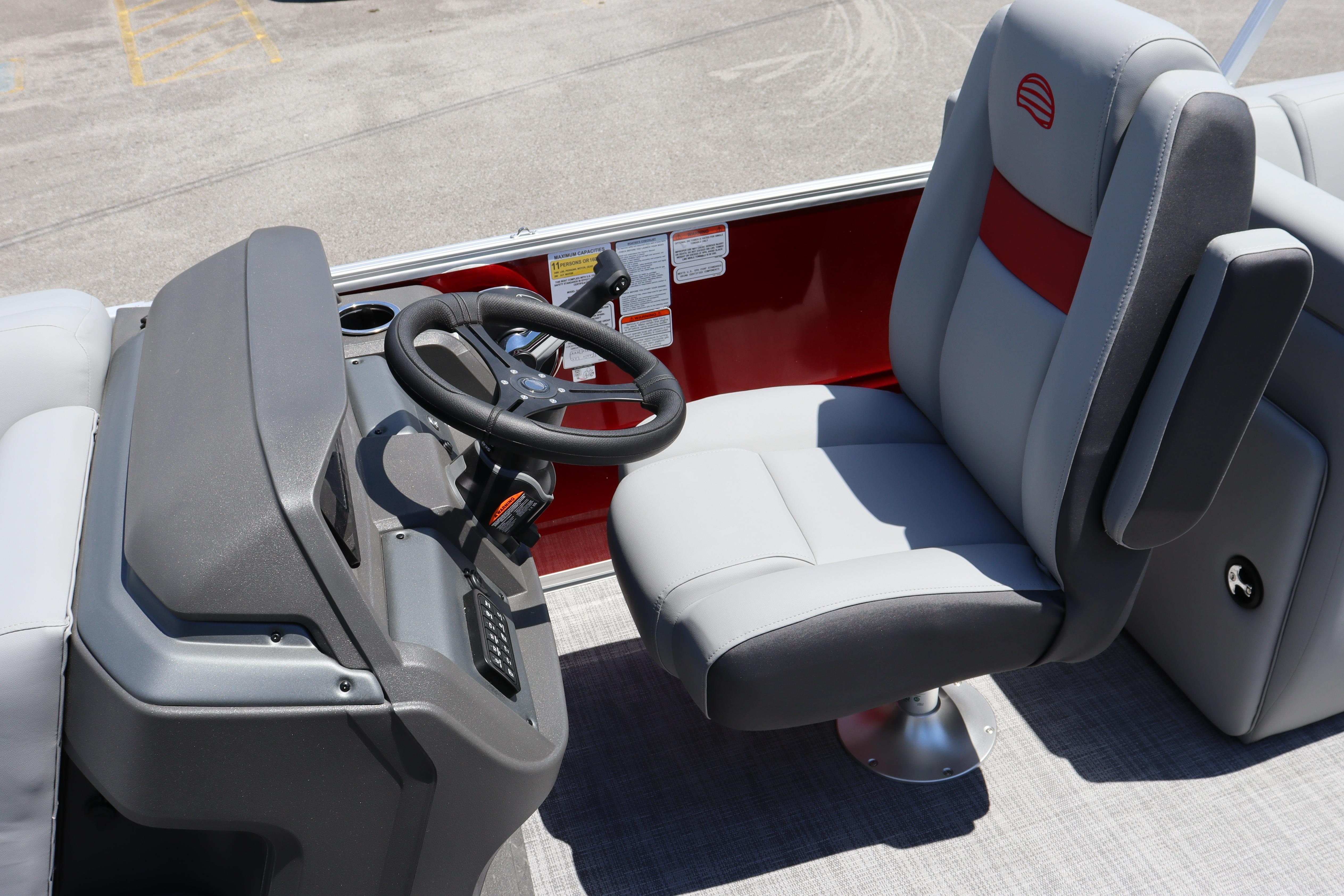 Captain's seat and helm of 2026 Sun Tracker Party Barge 22 XP3 pontoon boat.