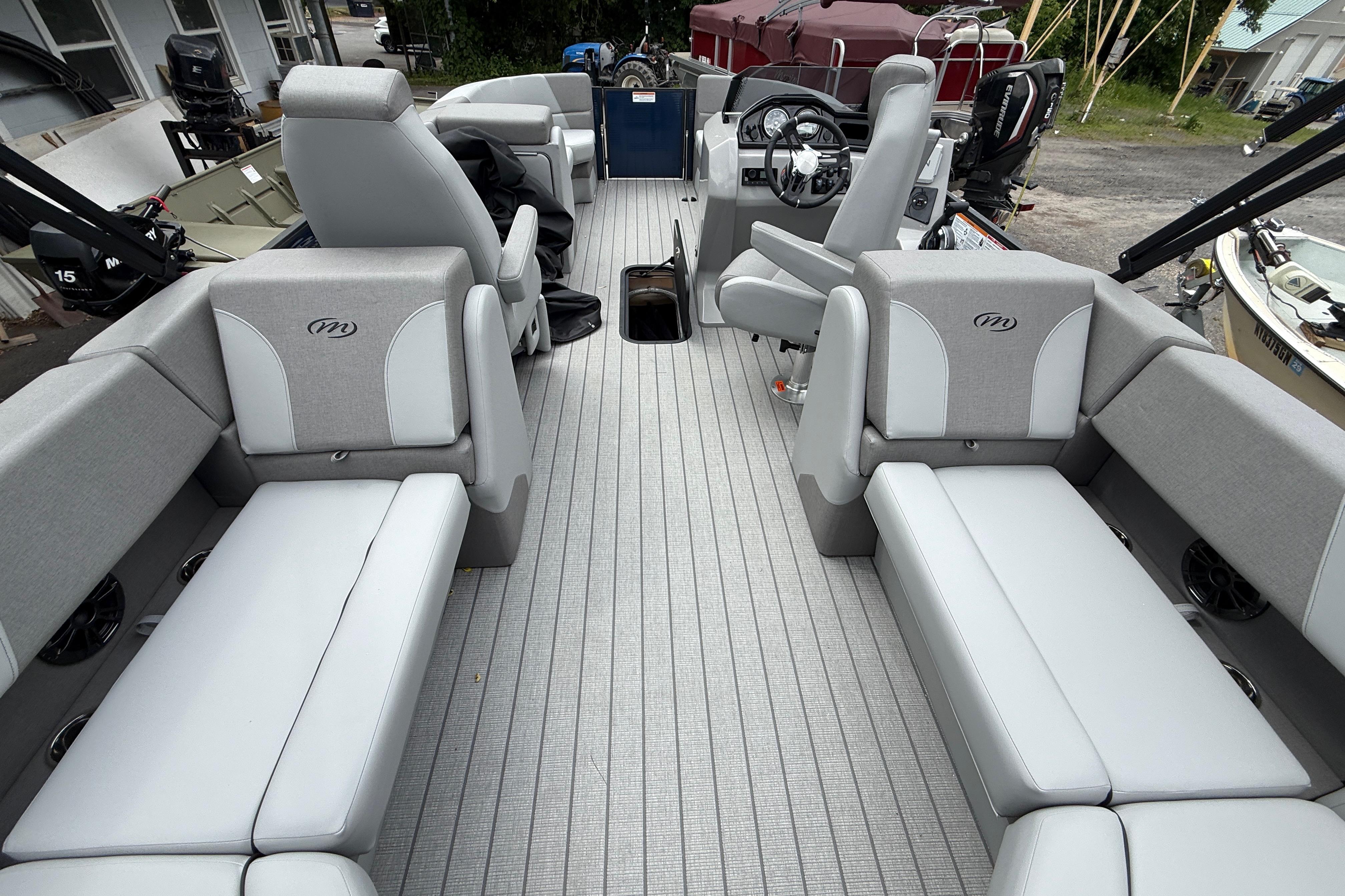 2027 Manitou Aurora RF 23 pontoon boat interior with gray seating and modern design.