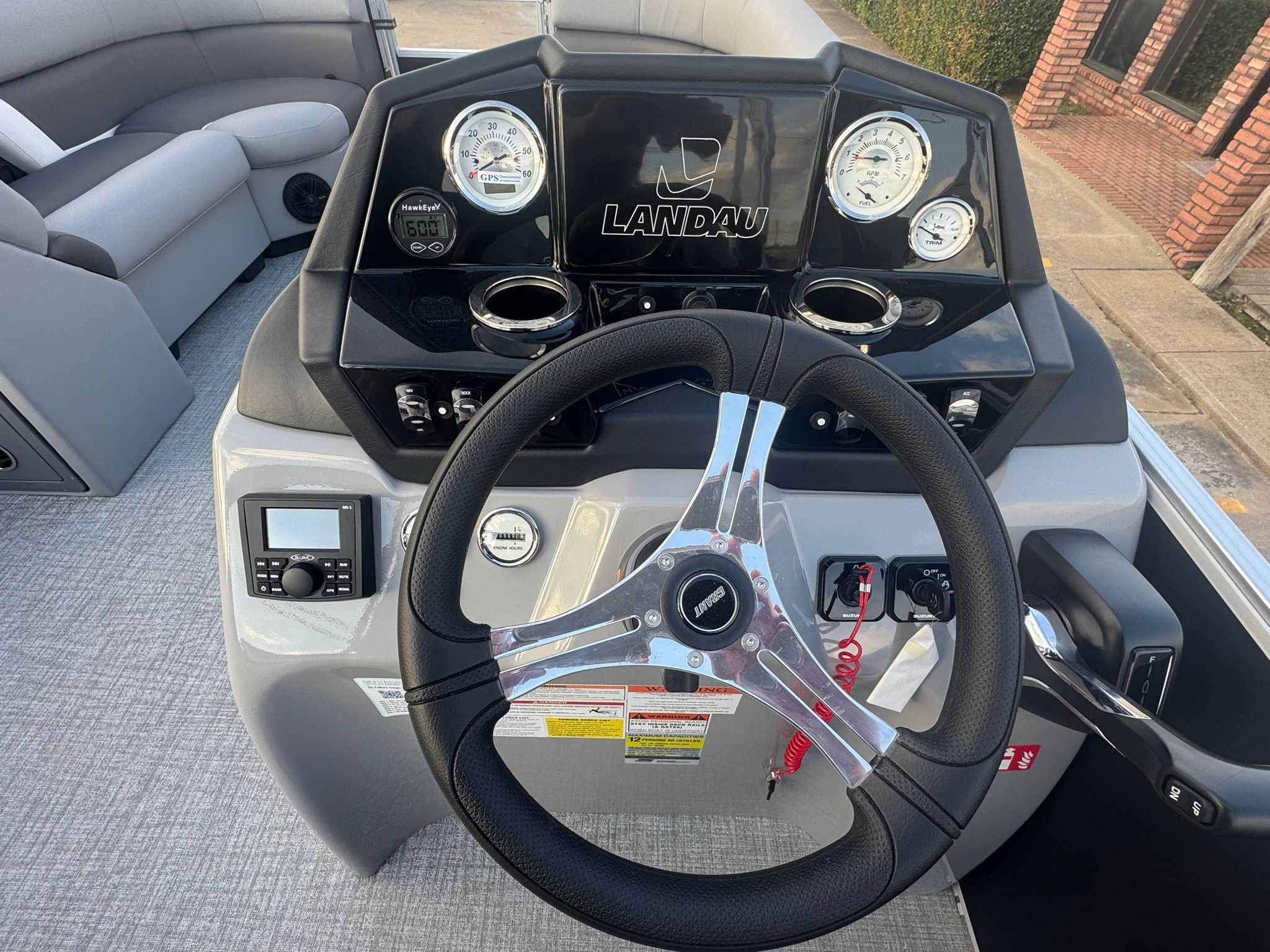 Dashboard of 2026 Landau 23 Island Breeze with steering wheel and gauges.