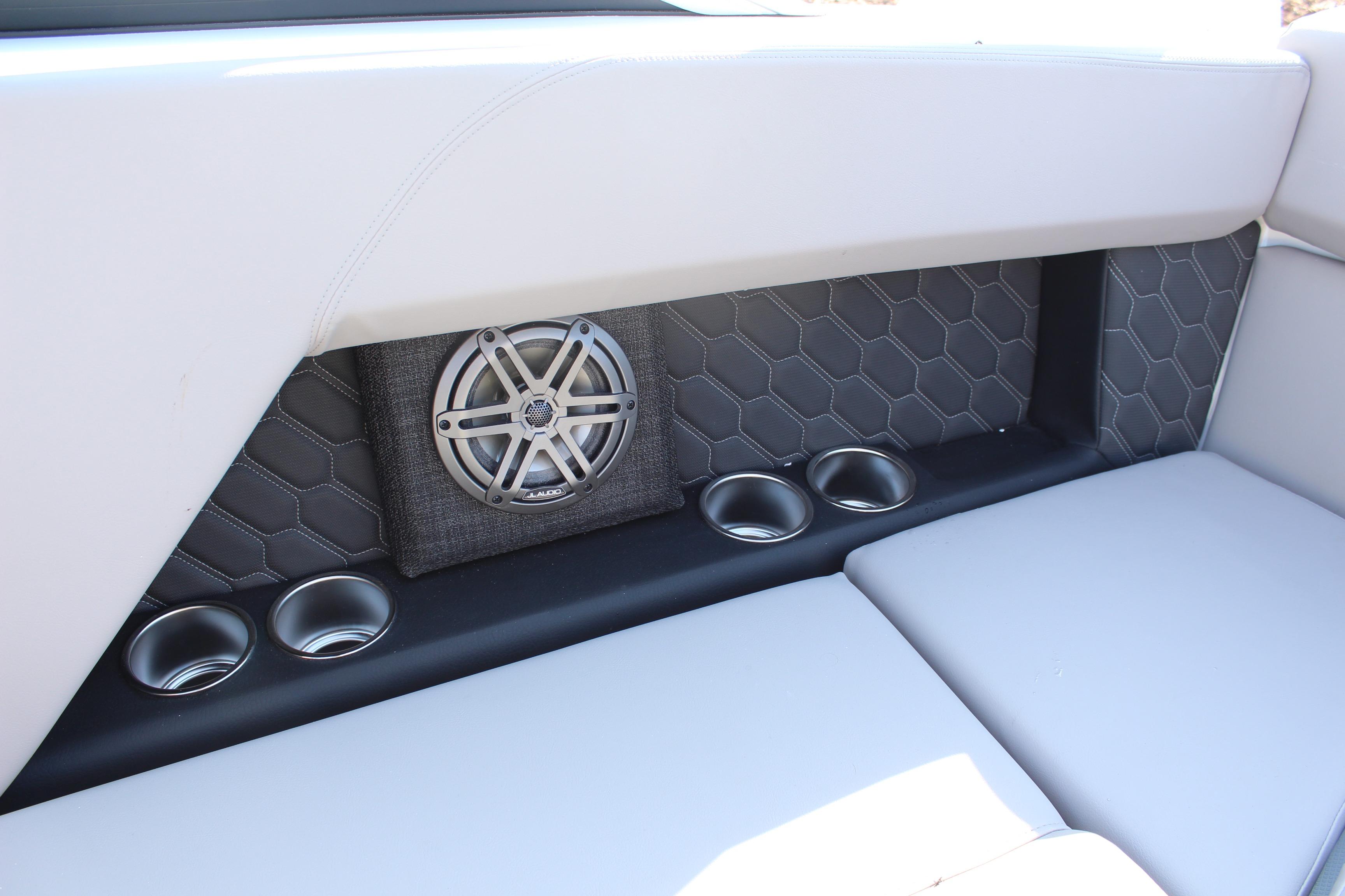 2026 Four Winns H4 boat interior with speaker and cup holders.