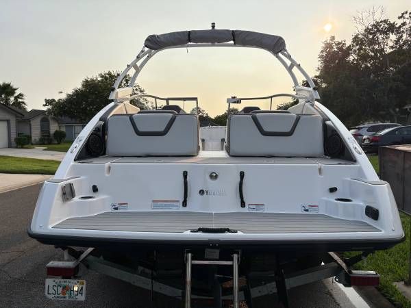 Rear view of a 2021 Yamaha Boats AR250 on a trailer.