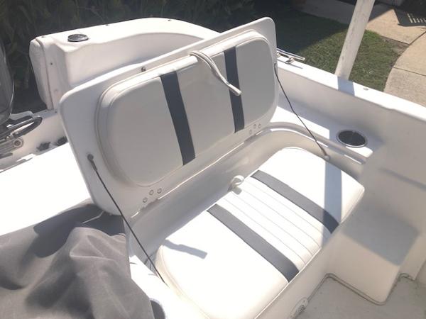 2011 Carolina Skiff 258 DLV boat seat with white and black upholstery.