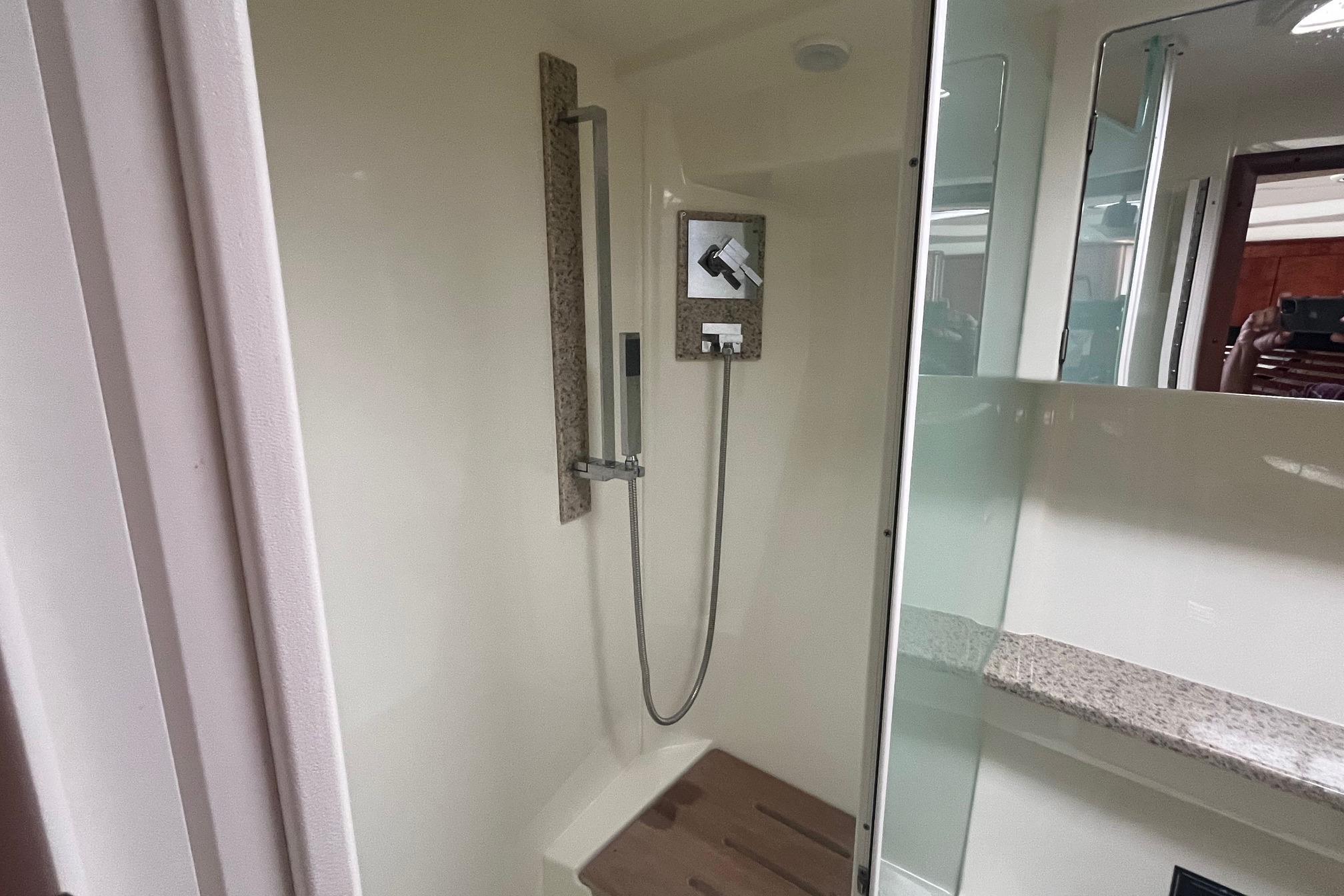 Shower area in 2010 Monterey 400 Sport Yacht with modern fixtures and granite accents.