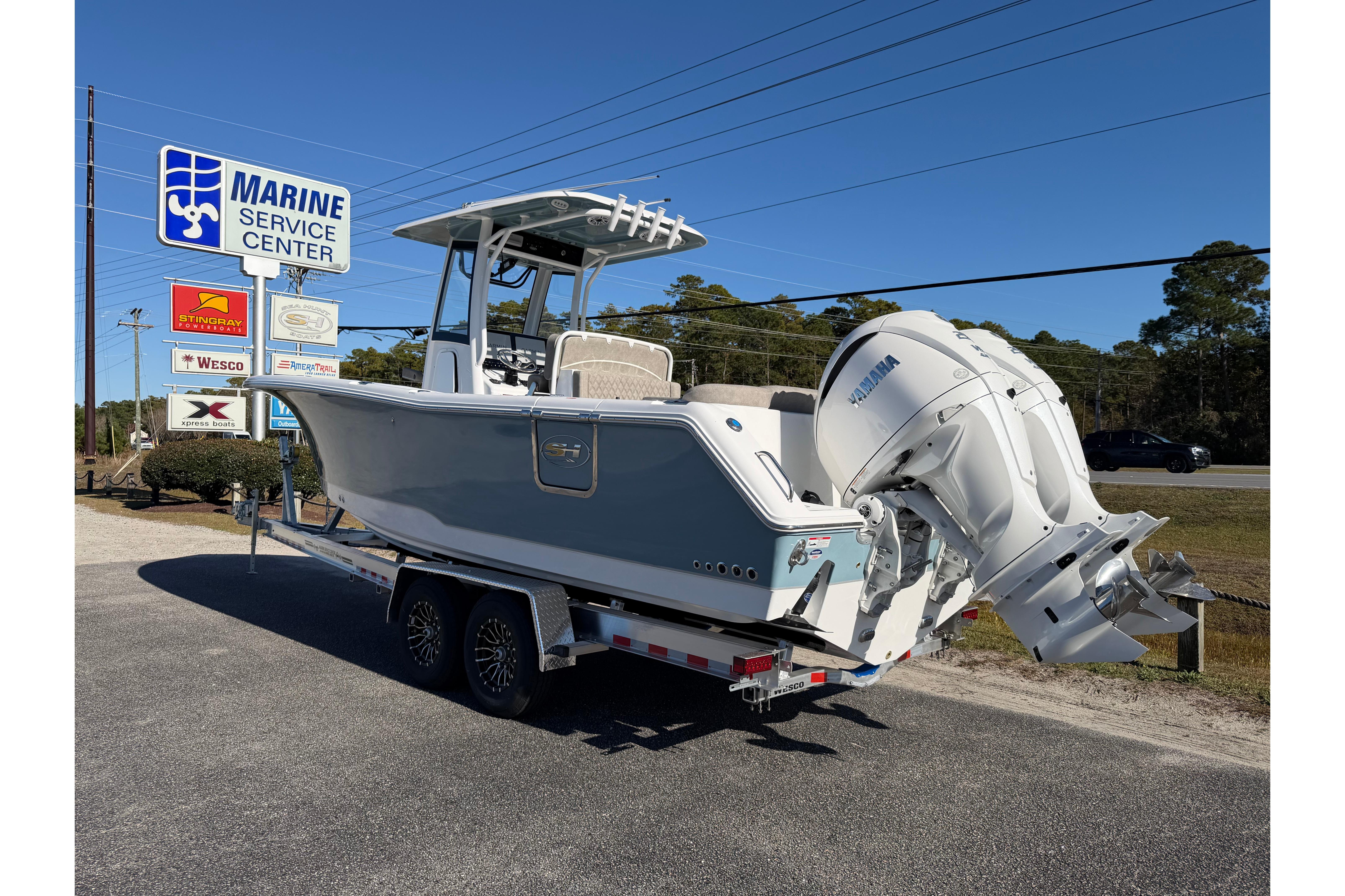 2026 Sea Hunt Ultra 275 Coffin Box boat on trailer at Marine Service Center.