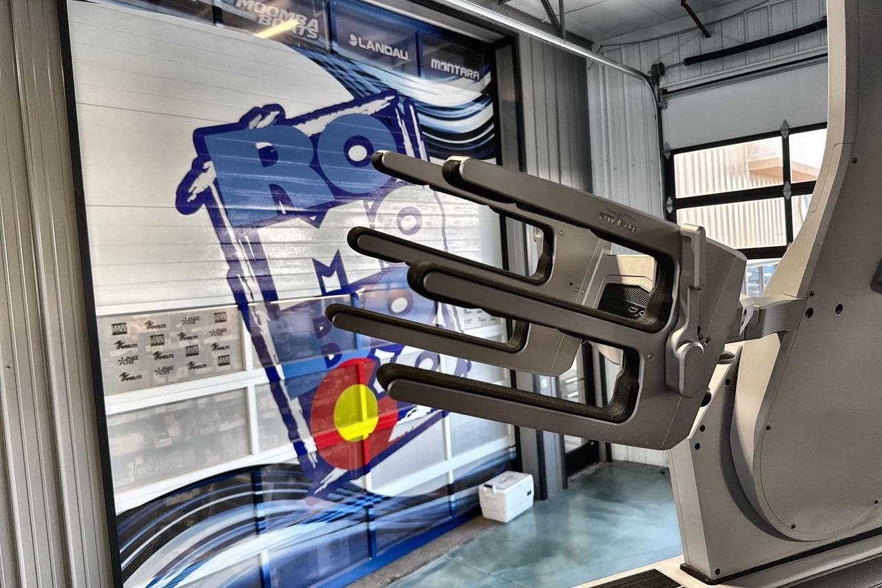 2021 Supra SE 550 boat accessory in a showroom with colorful graphics.