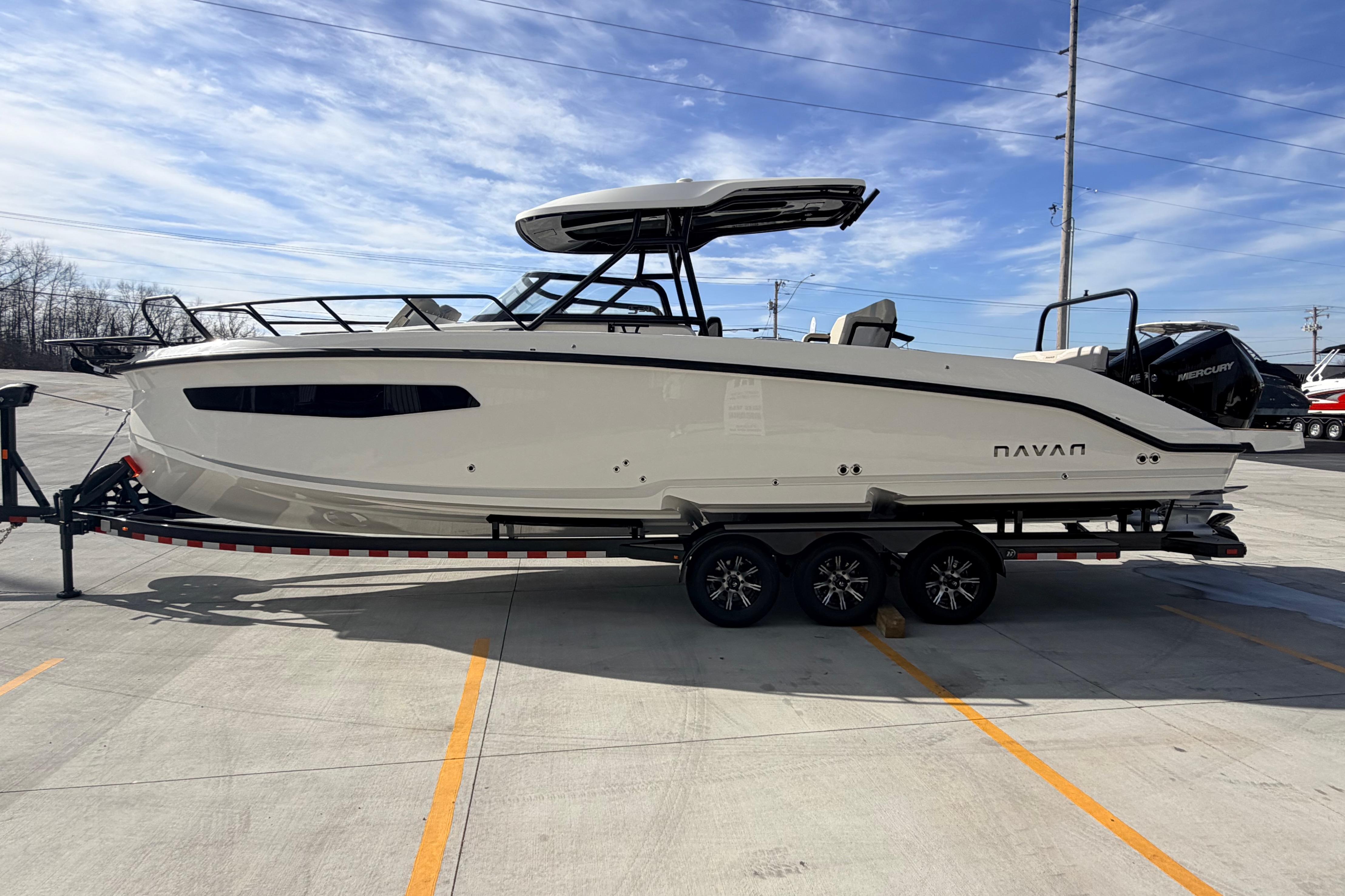 2026 Navan S30 boat on trailer under clear blue sky.