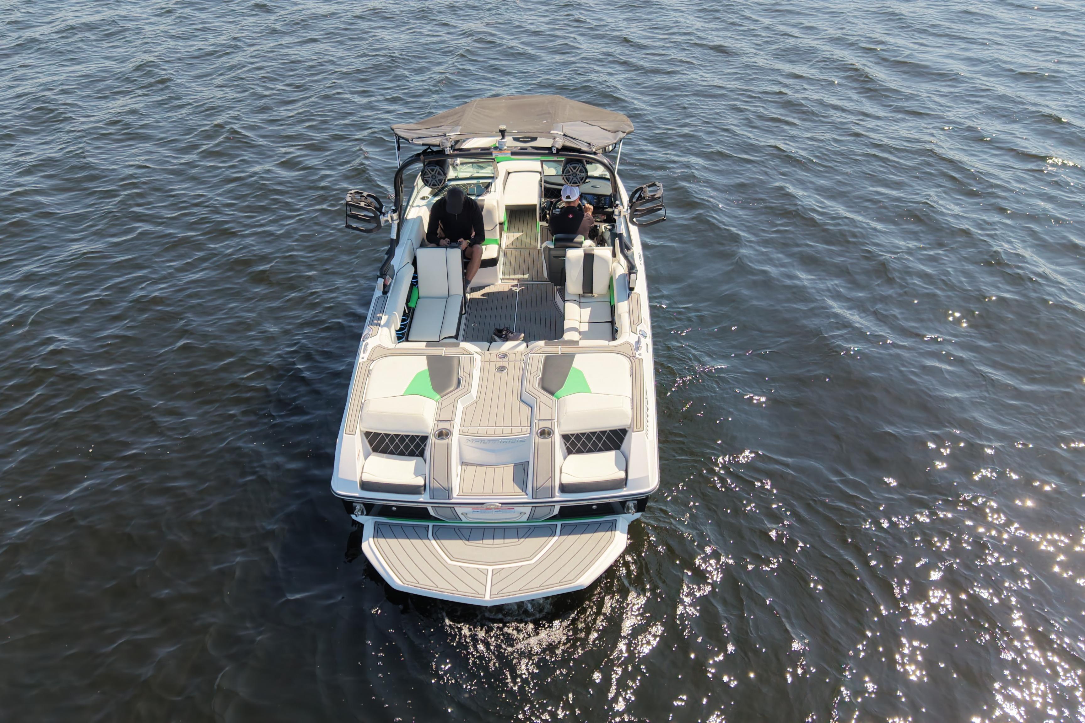 2019 Nautique Super Air Nautique GS22 boat on open water, aerial view.