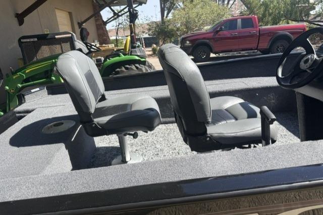 2026 Tracker Super Guide V-16 SC boat interior with two gray seats.