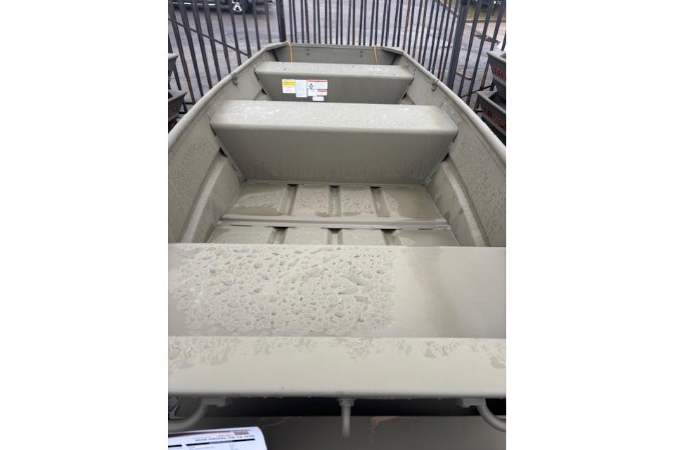 2026 Tracker Grizzly 12 Jon boat interior with bench seats and textured floor.