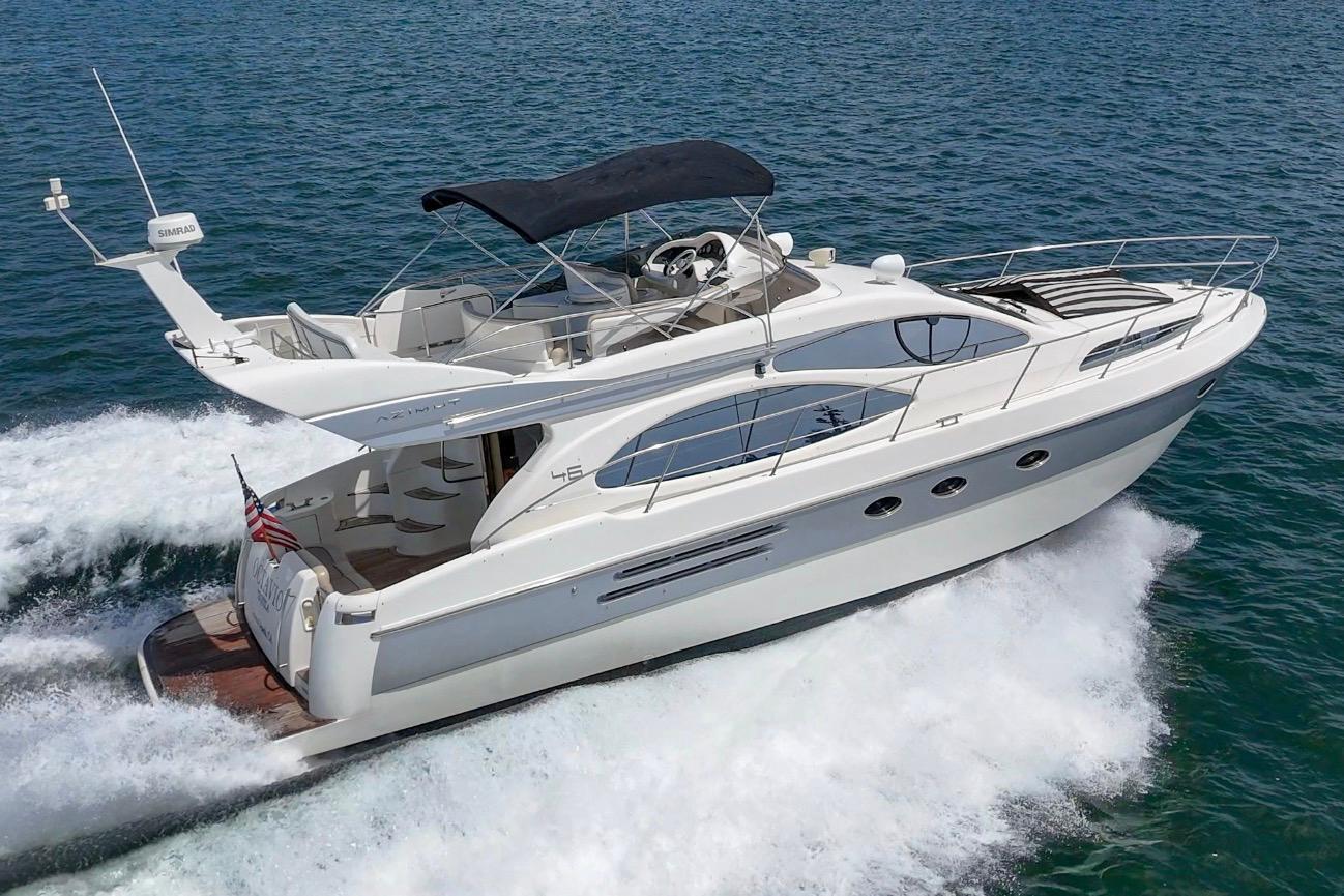 2004 Azimut 46 yacht cruising on open water, showcasing sleek design and luxury features.