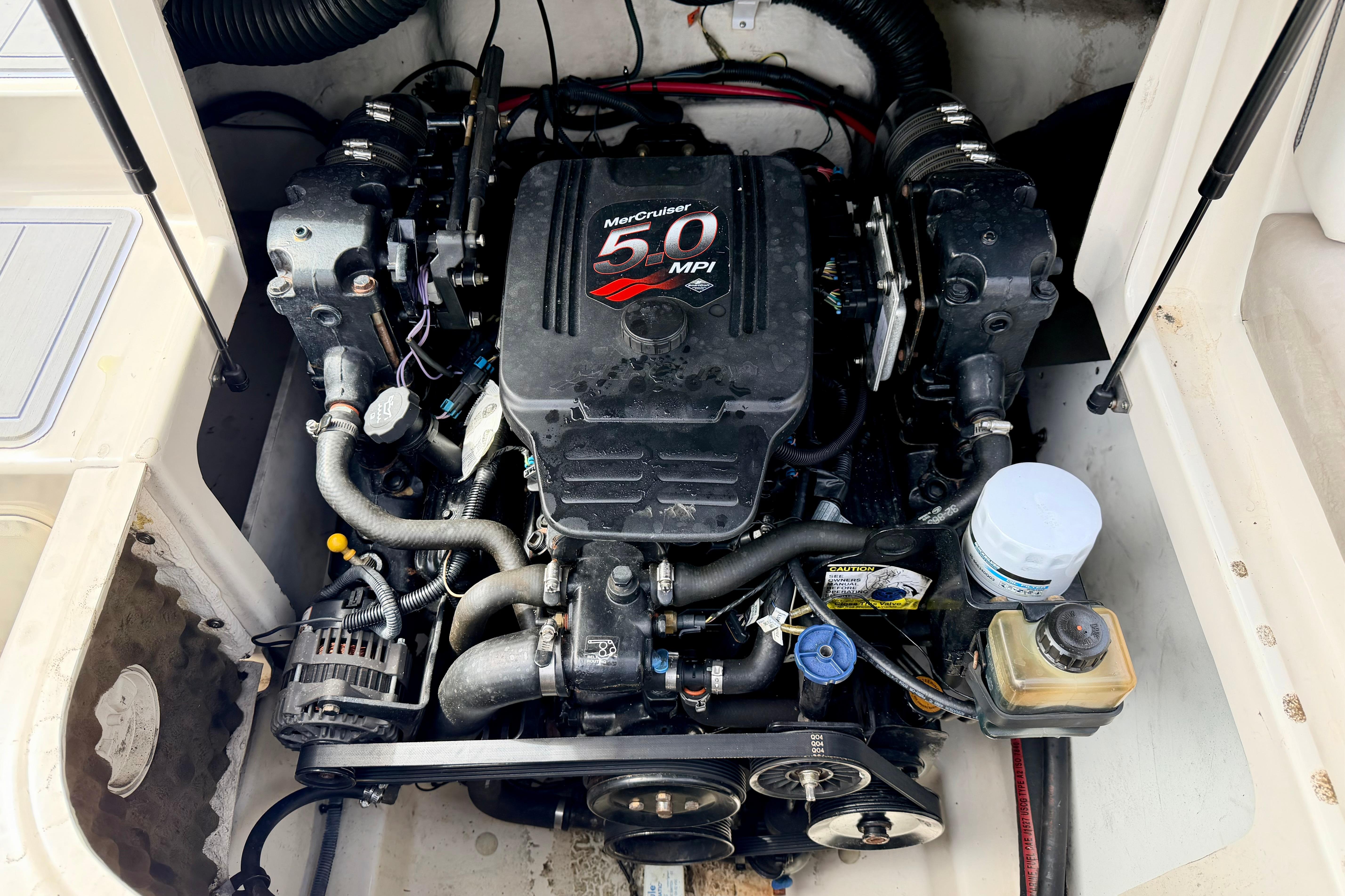 Engine of a 2003 Sea Ray 200 Sundeck boat, featuring a MerCruiser 5.0 MPI.