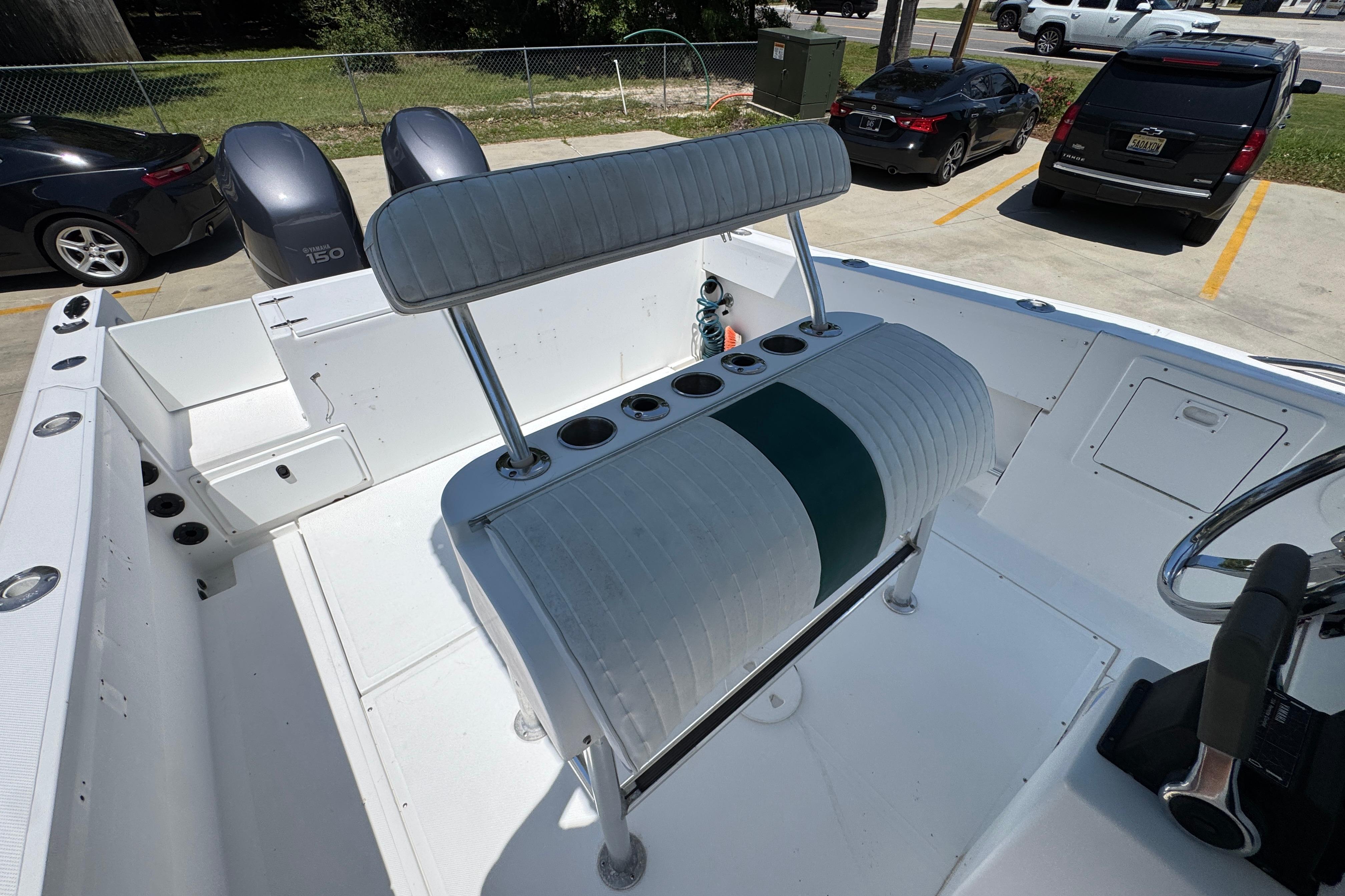 2000 Stamas 250 Tarpon boat interior with seating and dual Yamaha 150 engines.