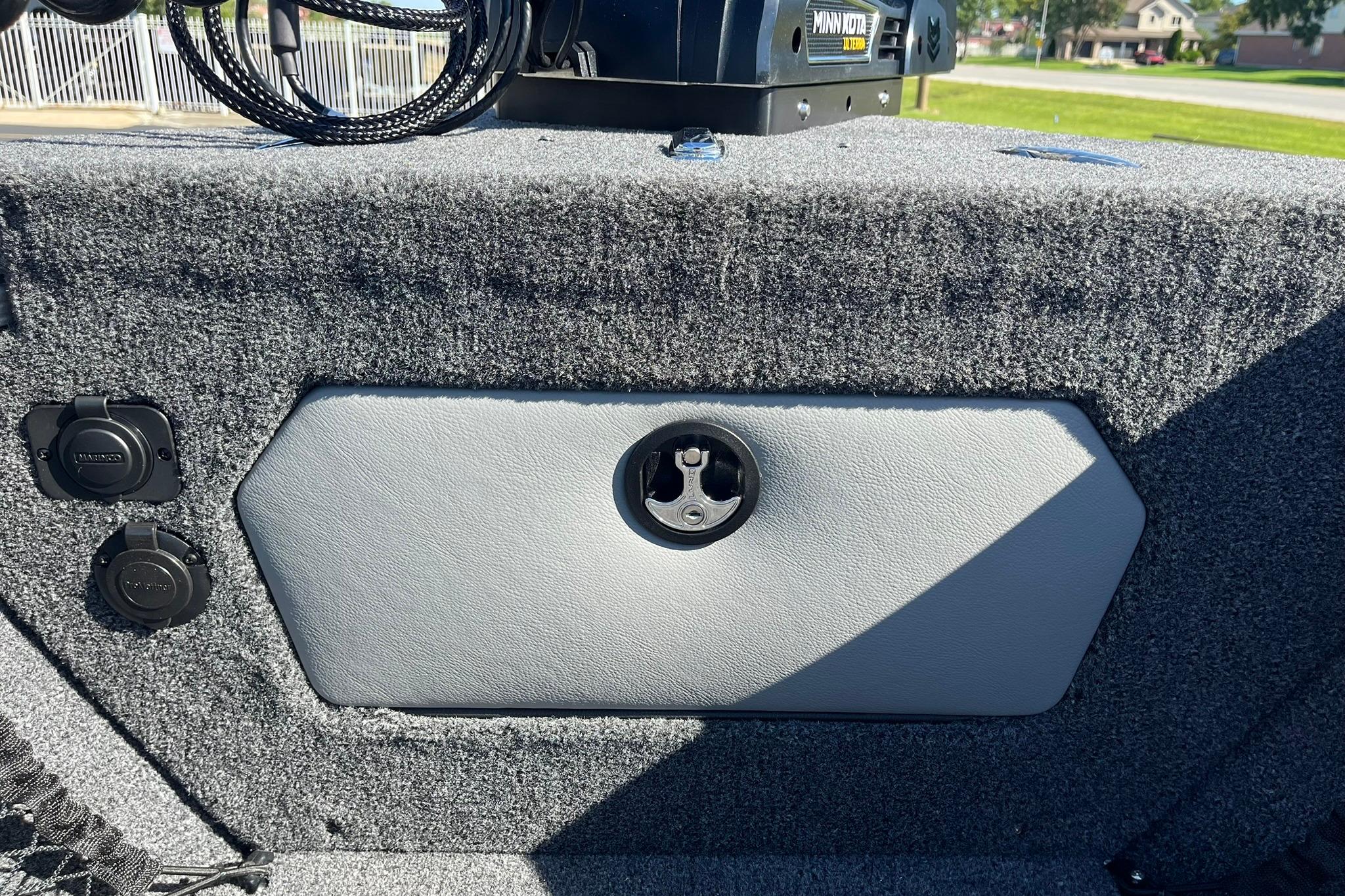 Interior of 2026 Lund 2275 Baron boat with Minn Kota equipment and carpeted finish.