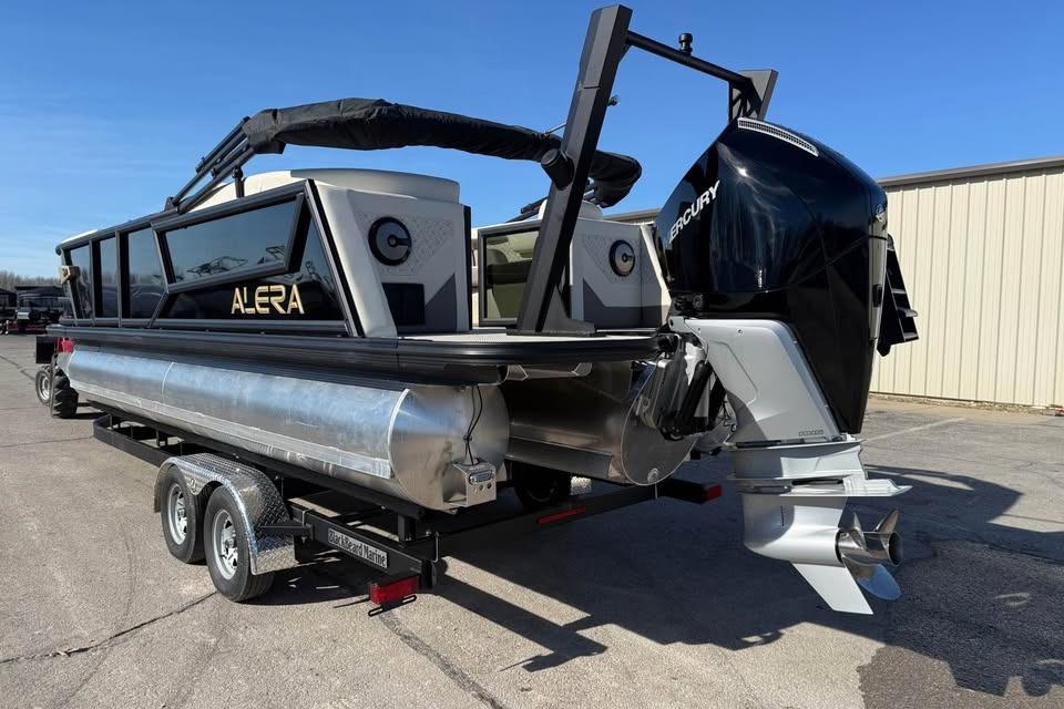 Alera MQ23 2026 pontoon boat on trailer with Mercury outboard motor.