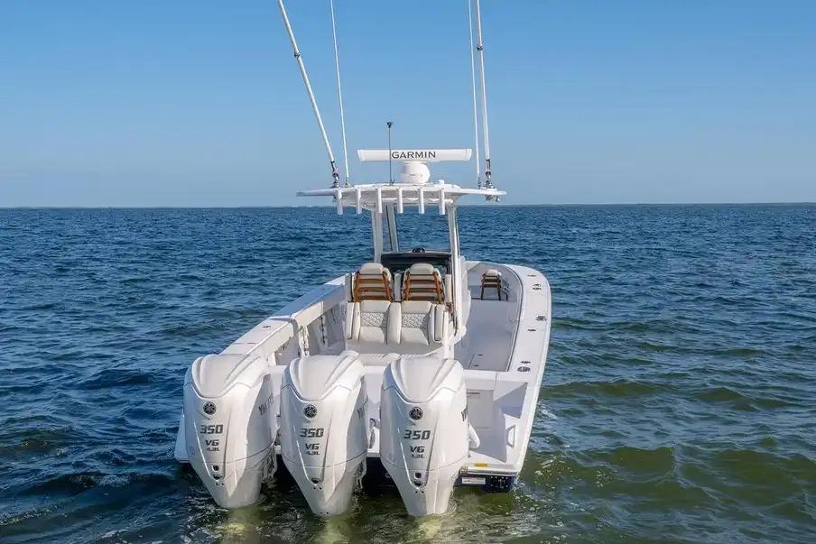 Manufacturer Provided Image: 2026 Jupiter 340LS boat with triple 350 V6 engines on open sea.