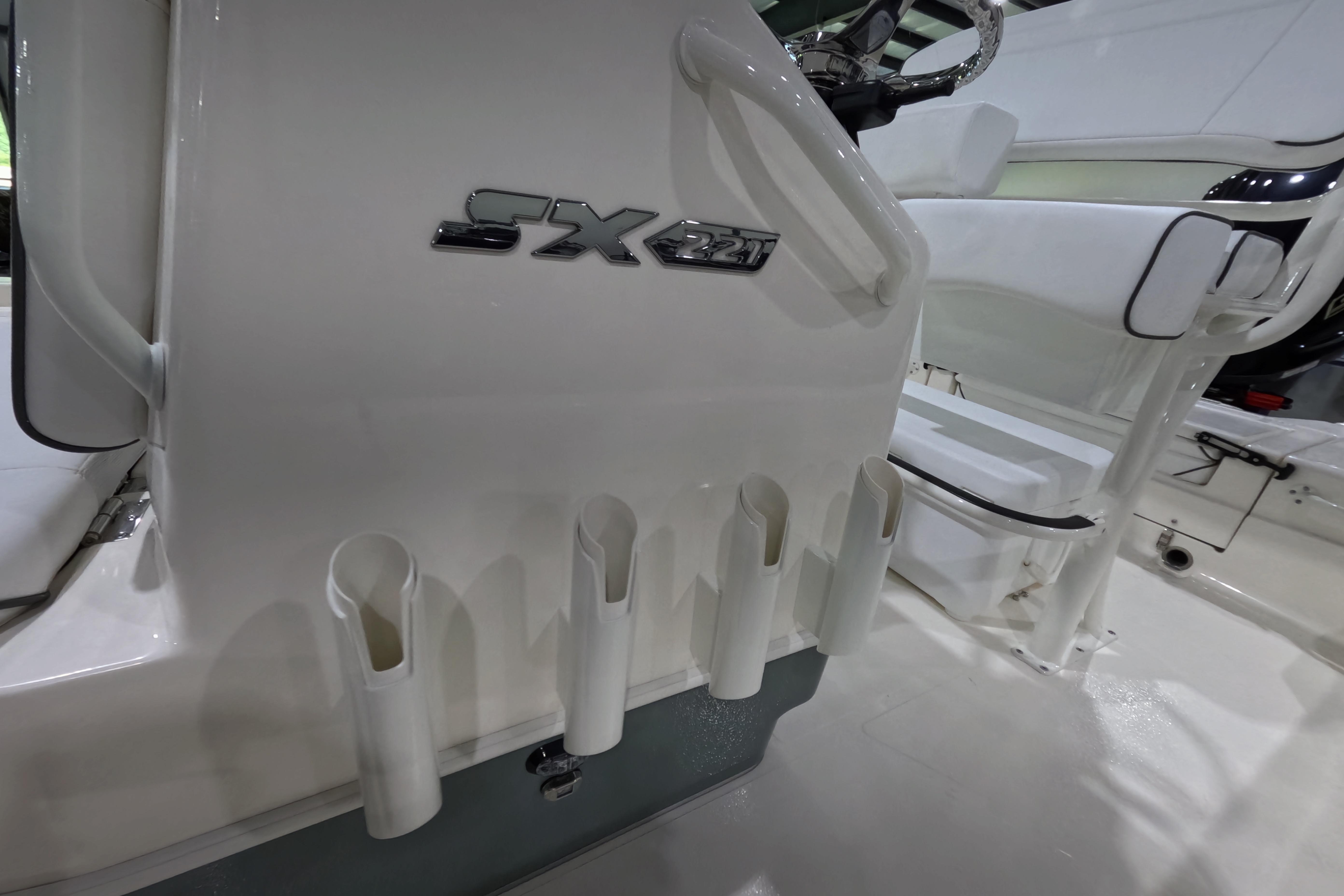2026 Skeeter SX 221 boat interior with rod holders and steering console.