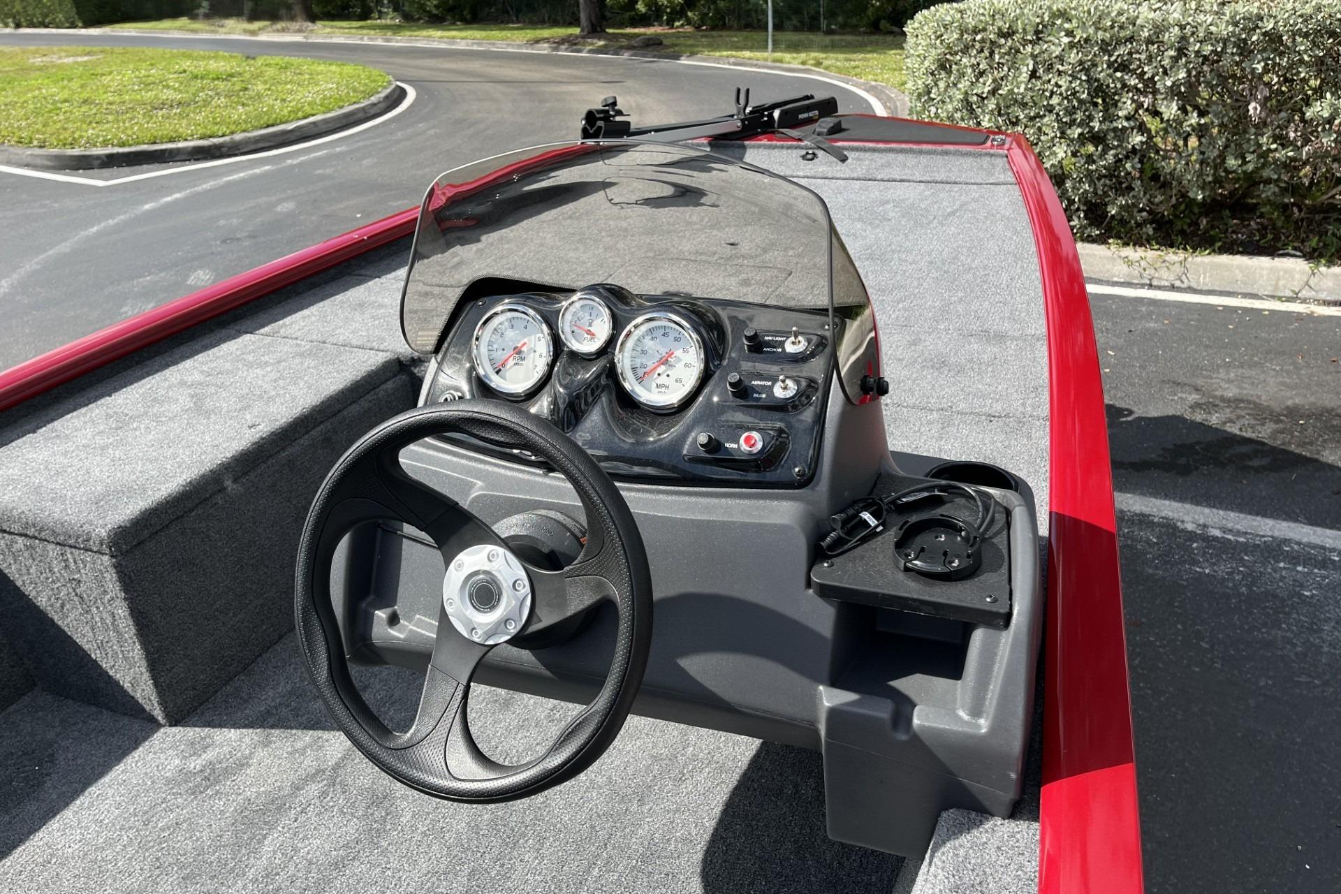 2026 Tracker Pro 170 boat dashboard with steering wheel and gauges.