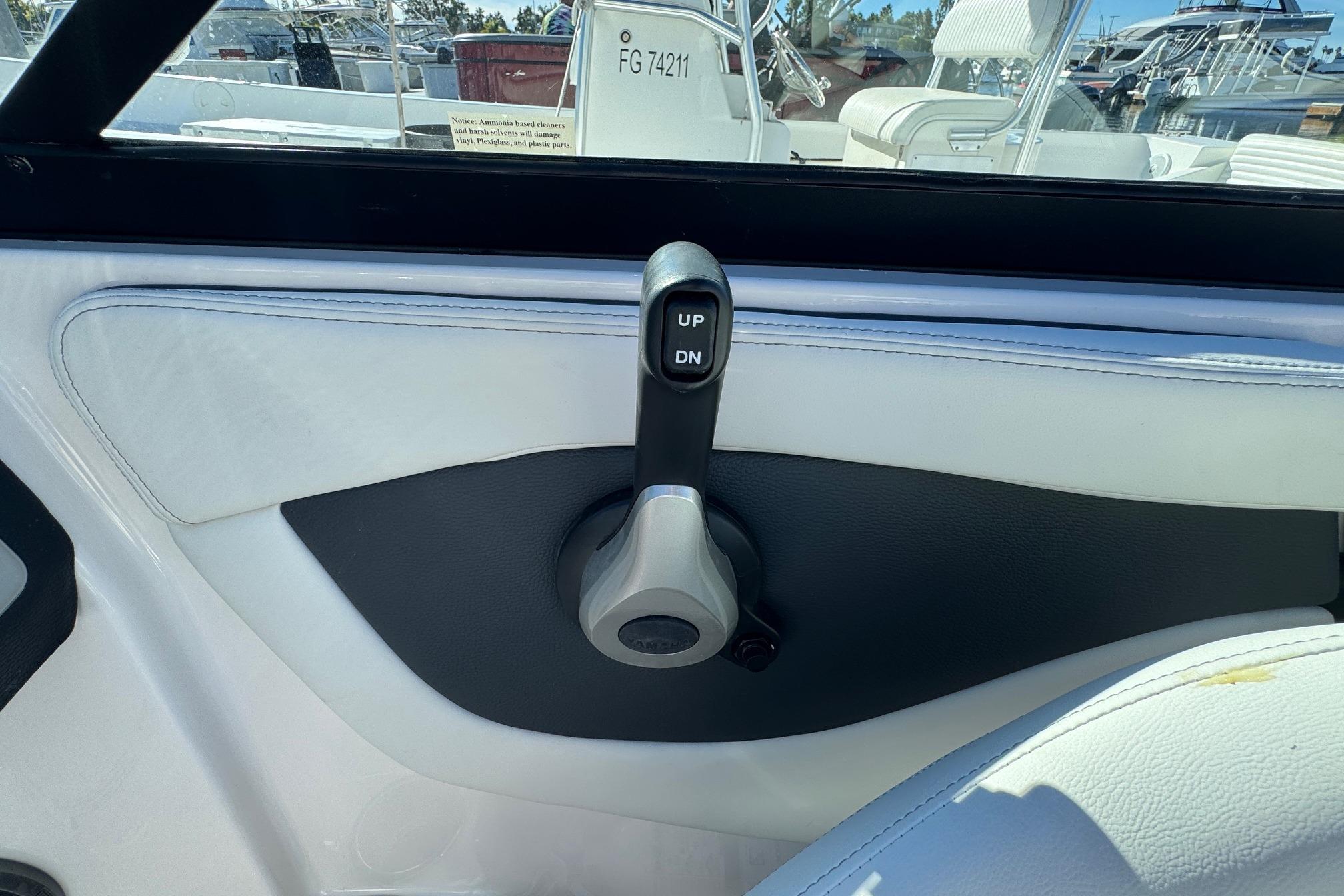 2026 Regal 21 OBX boat interior with control lever, labeled "UP" and "DN".
