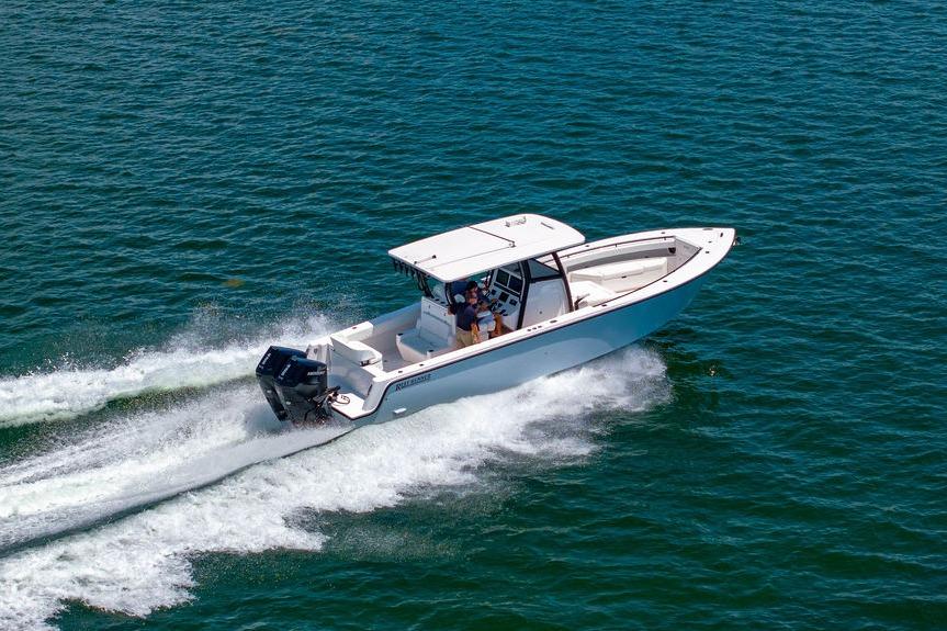 2027 Reef Runner 340 boat cruising on open water, showcasing sleek design and performance.