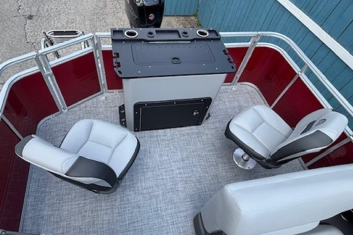 2026 Sun Tracker SportFish 20 DLX boat interior with seating and control panel.