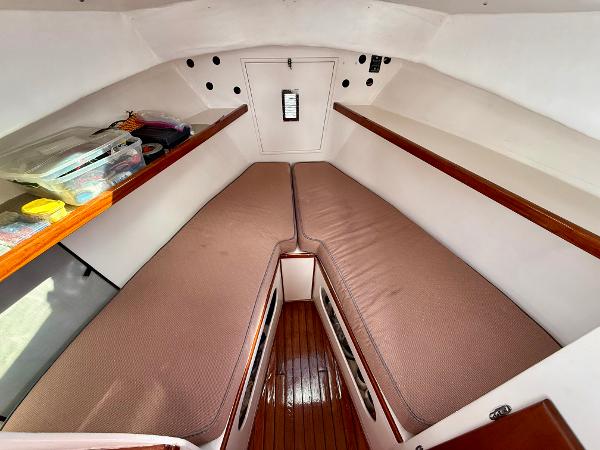 1978 Dyer 29 Trunk Cabin interior with twin berths and wooden flooring.