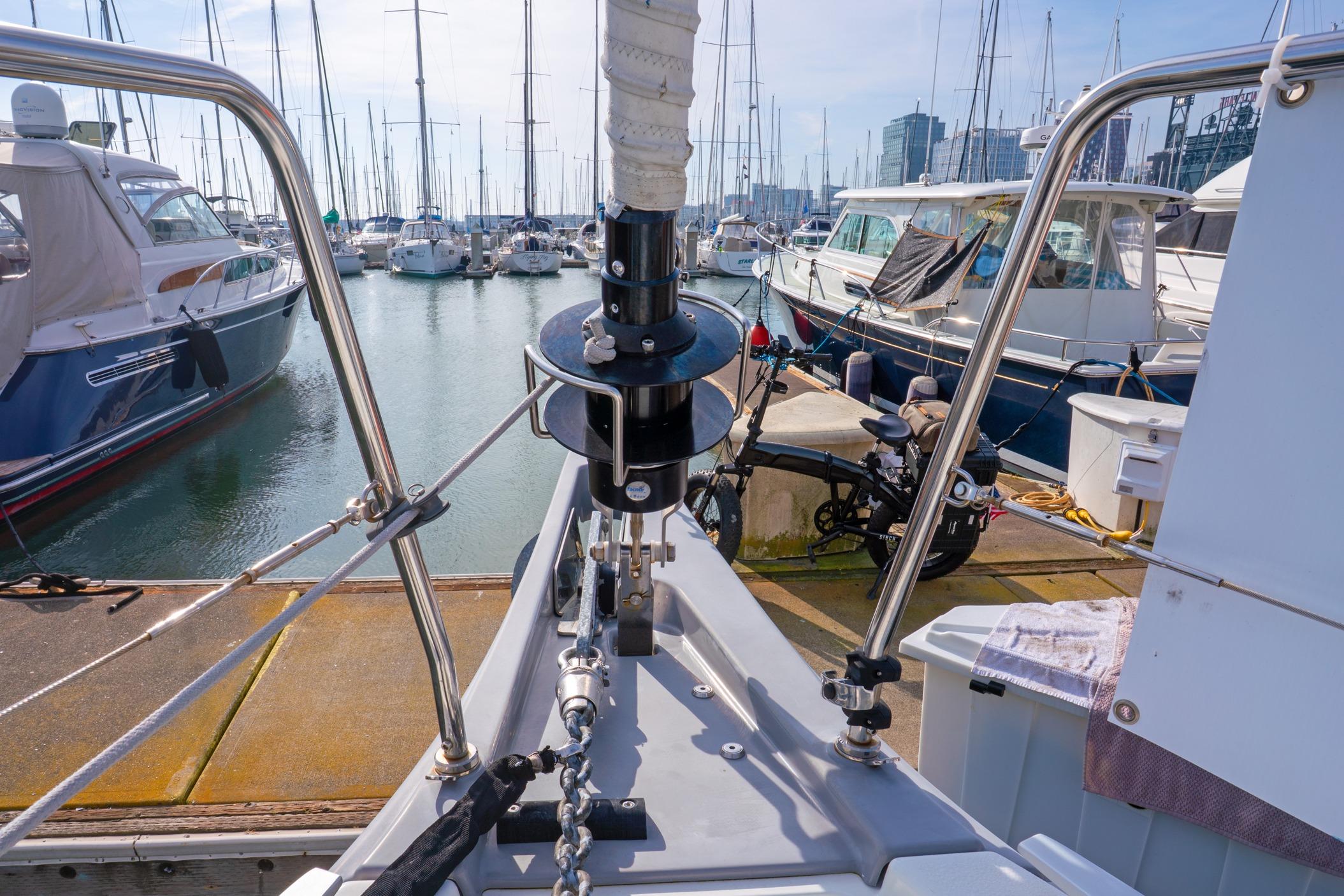 Beneteau Oceanis 461 sailboat docked in a marina, surrounded by other boats.