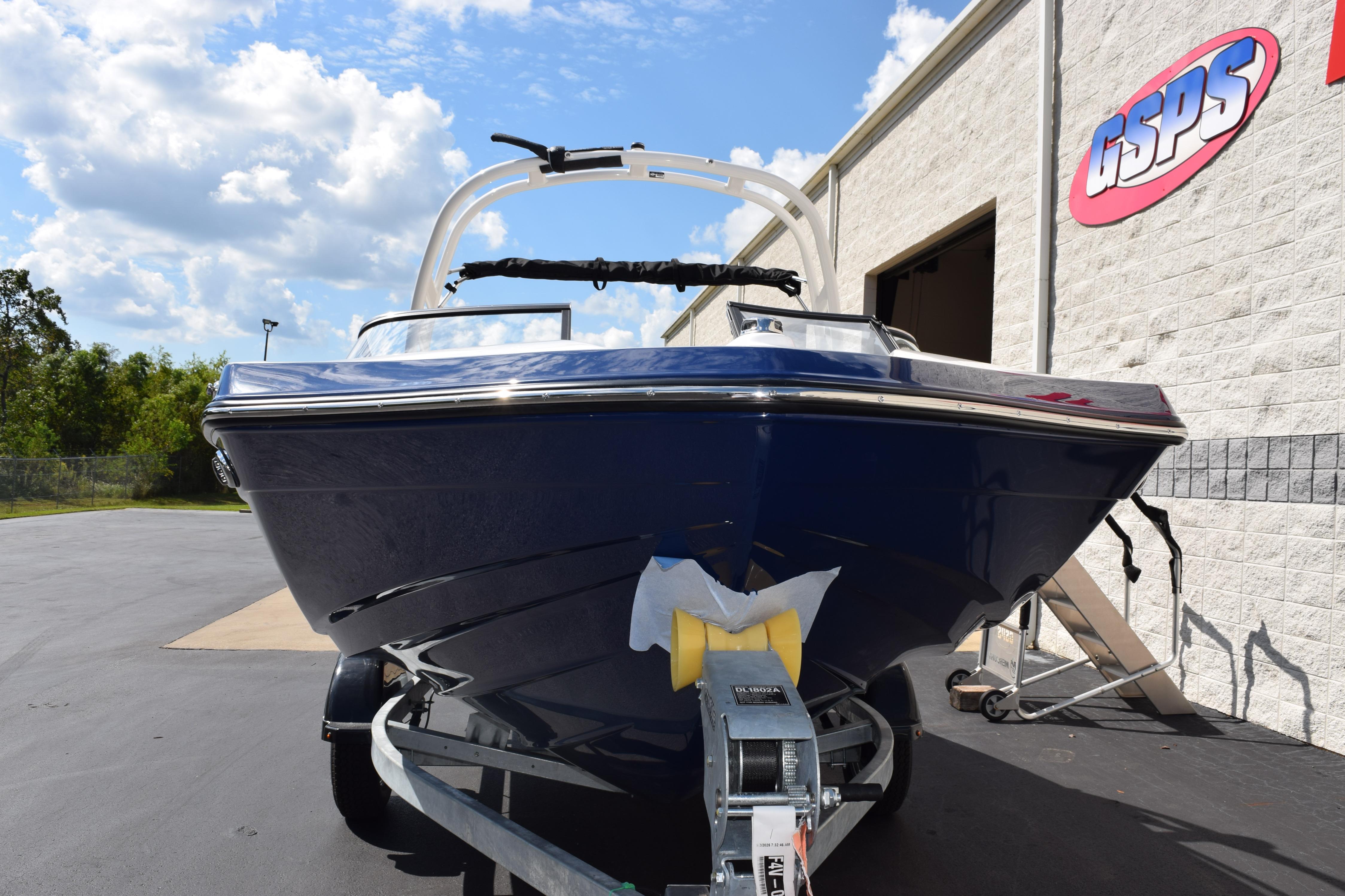 2026 Yamaha Boats 195S in blue, parked outside GSPS building under a cloudy sky.