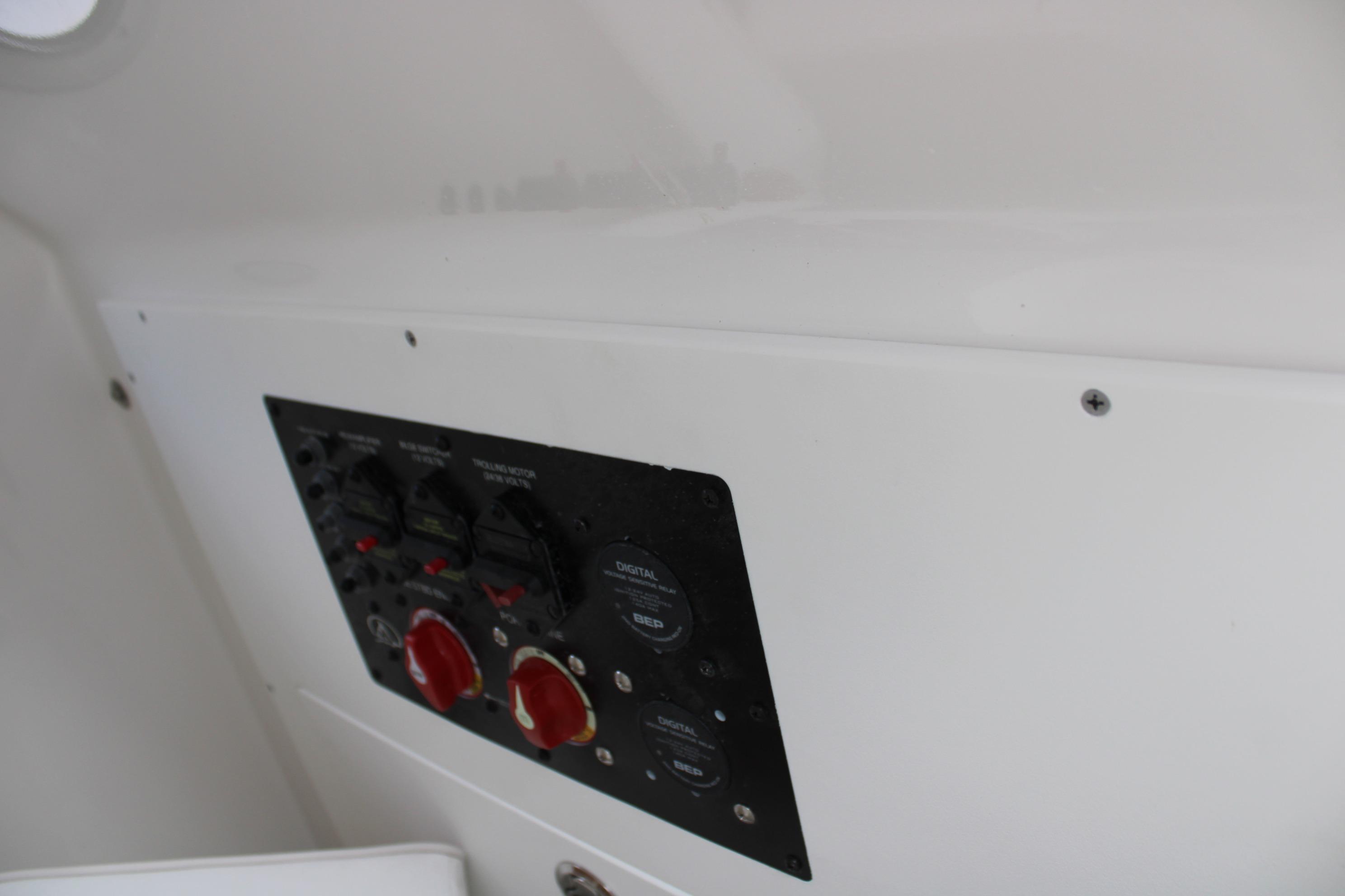 Control panel of 2027 Blazer Bay Makaira 2800 boat with switches and dials.