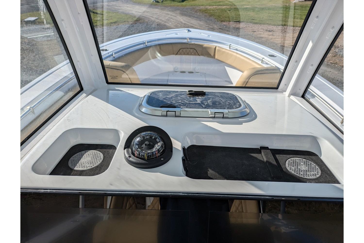 2025 Sportsman Open 282 Center Console boat interior with compass and hatch.