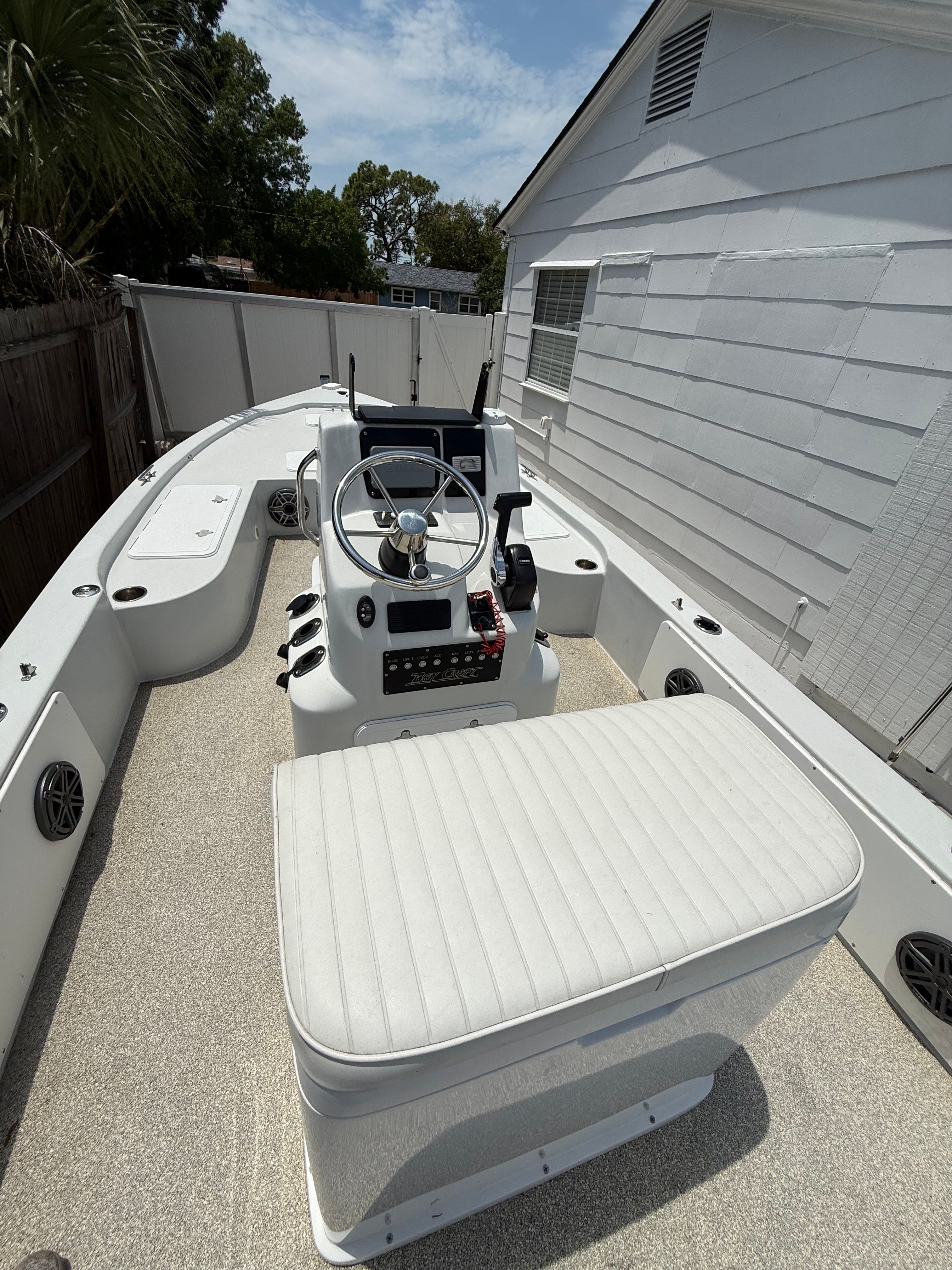 2012 Bay Craft 21 boat with steering console and bench seat.