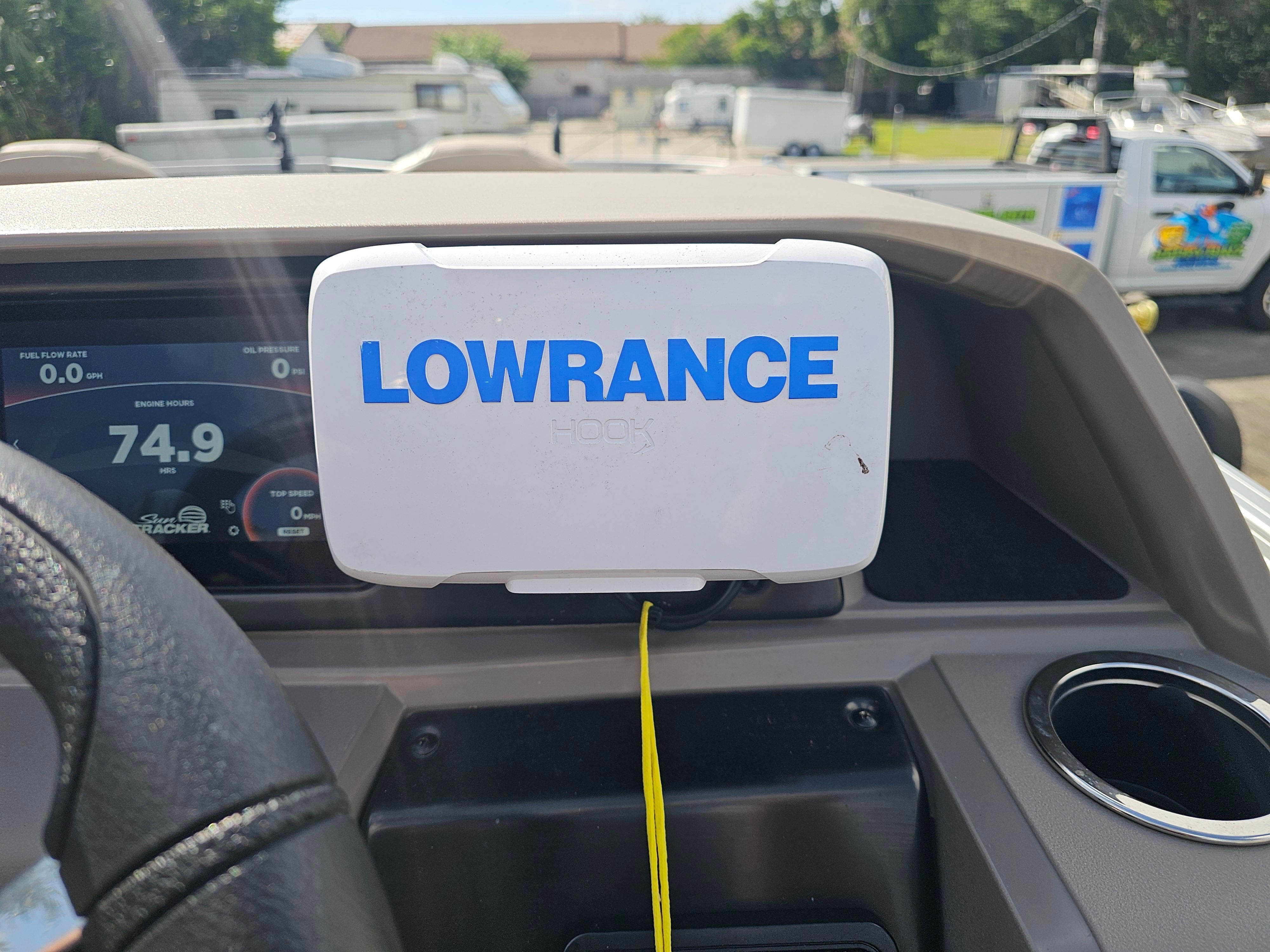 Lowrance device on Sun Tracker Fishin' Barge 22 DLX 2024 dashboard.