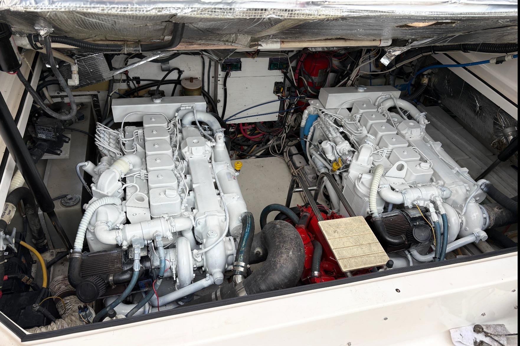 Engine compartment of a 2003 Tiara Yachts 3500 Open, showcasing dual marine engines.