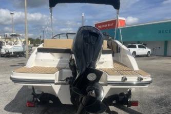 2017 Sea Ray SPX 210 Outboard boat, rear view, parked outdoors.