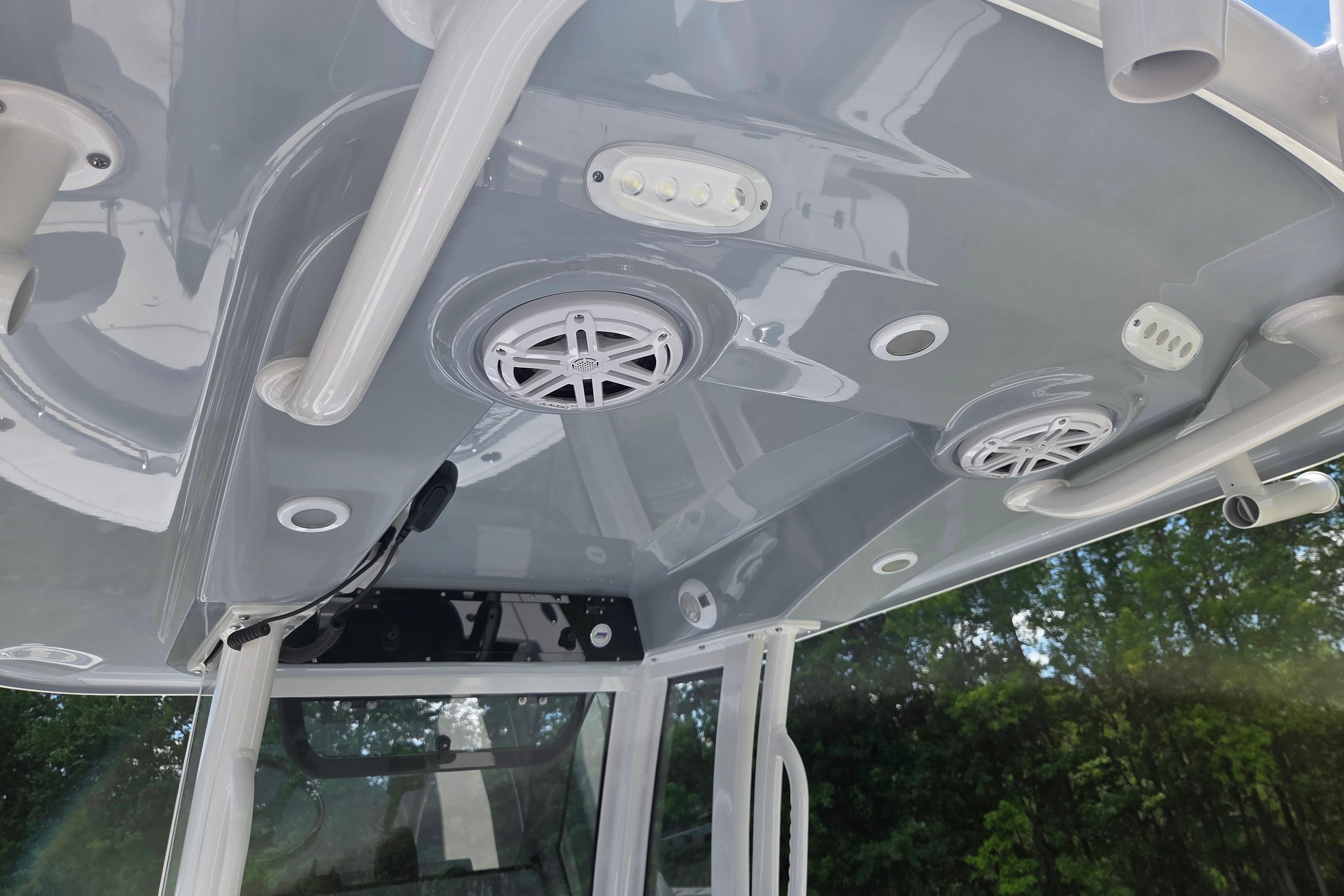 2026 Sportsman Open 212 Center Console boat roof with speakers and lights.