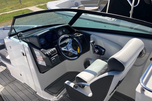 2024 Monterey M-65 boat cockpit with modern steering wheel and dashboard controls.