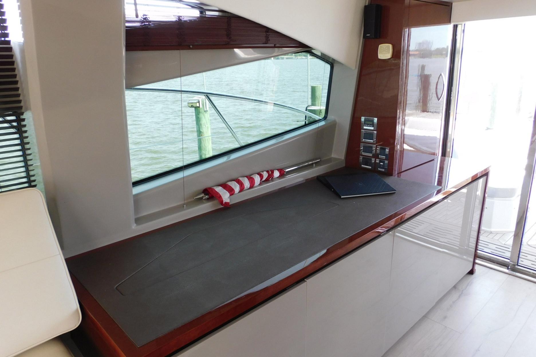 Interior of 2019 Sea Ray L550 yacht with sleek design and waterfront view.