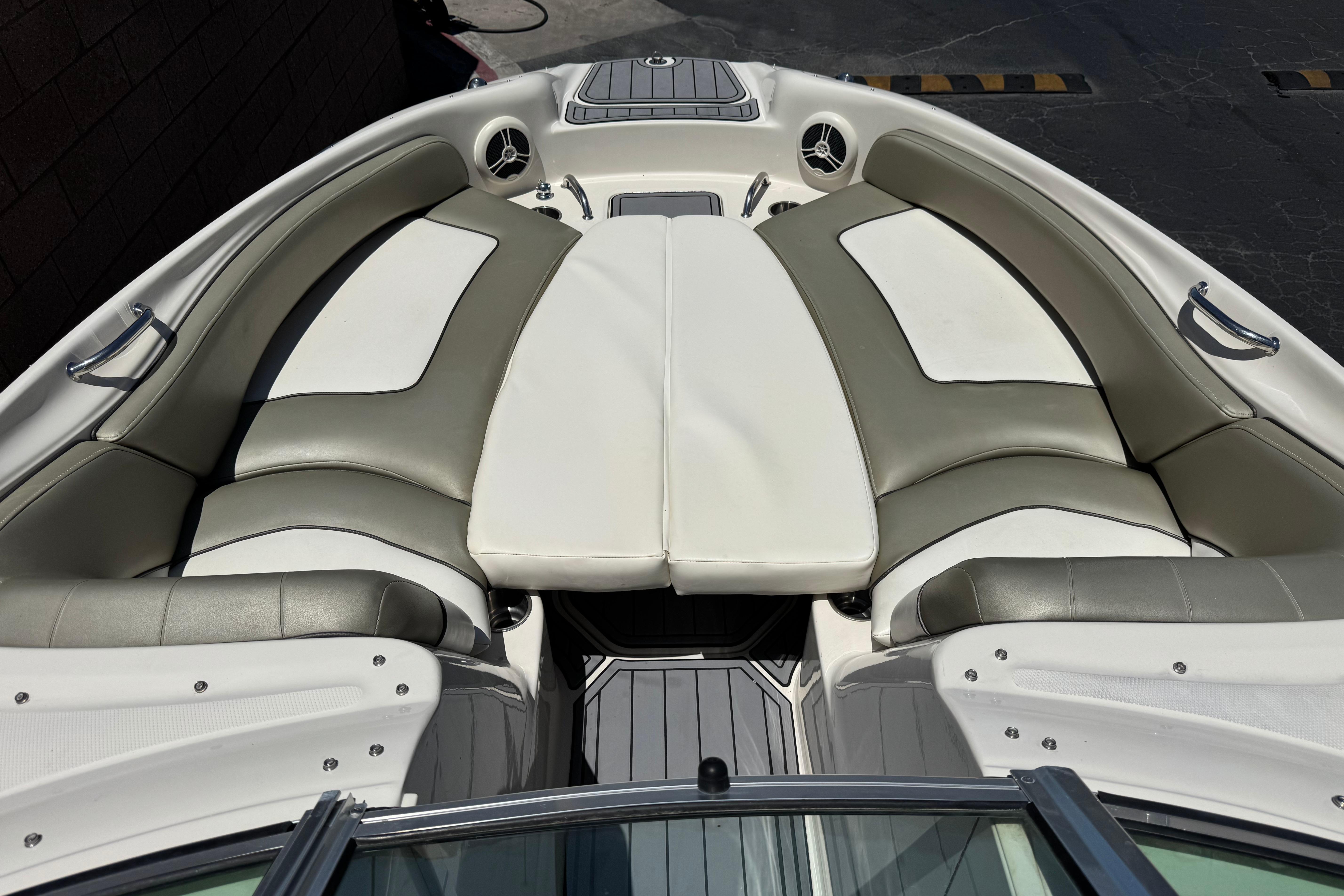 2007 Sea Ray 240 Sundeck boat interior with cushioned seating and sleek design.