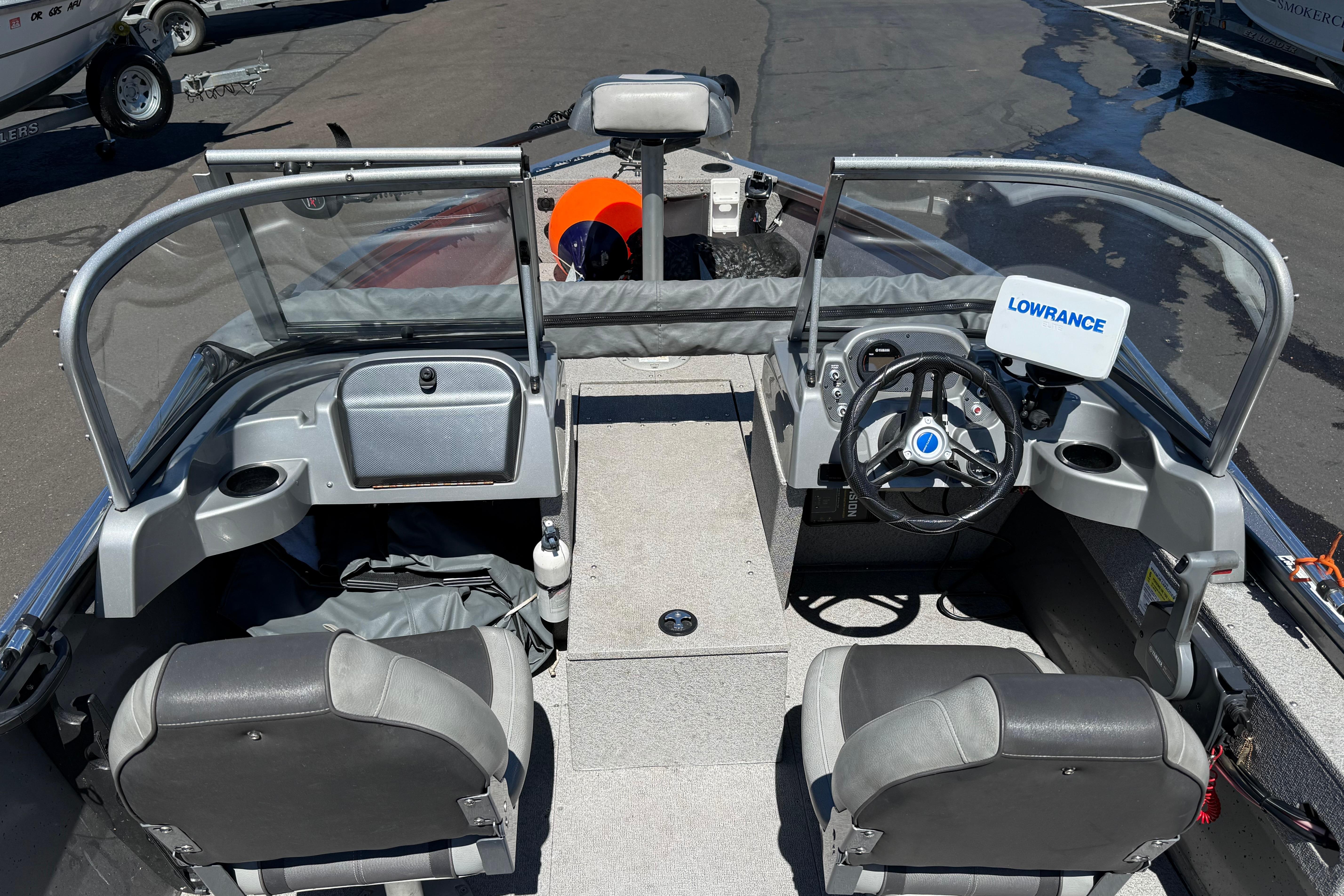 2016 Crestliner 1700 Vision boat interior with steering wheel and Lowrance equipment.