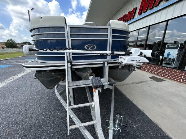 2020 Veranda VP22VLC pontoon boat parked outside a store.