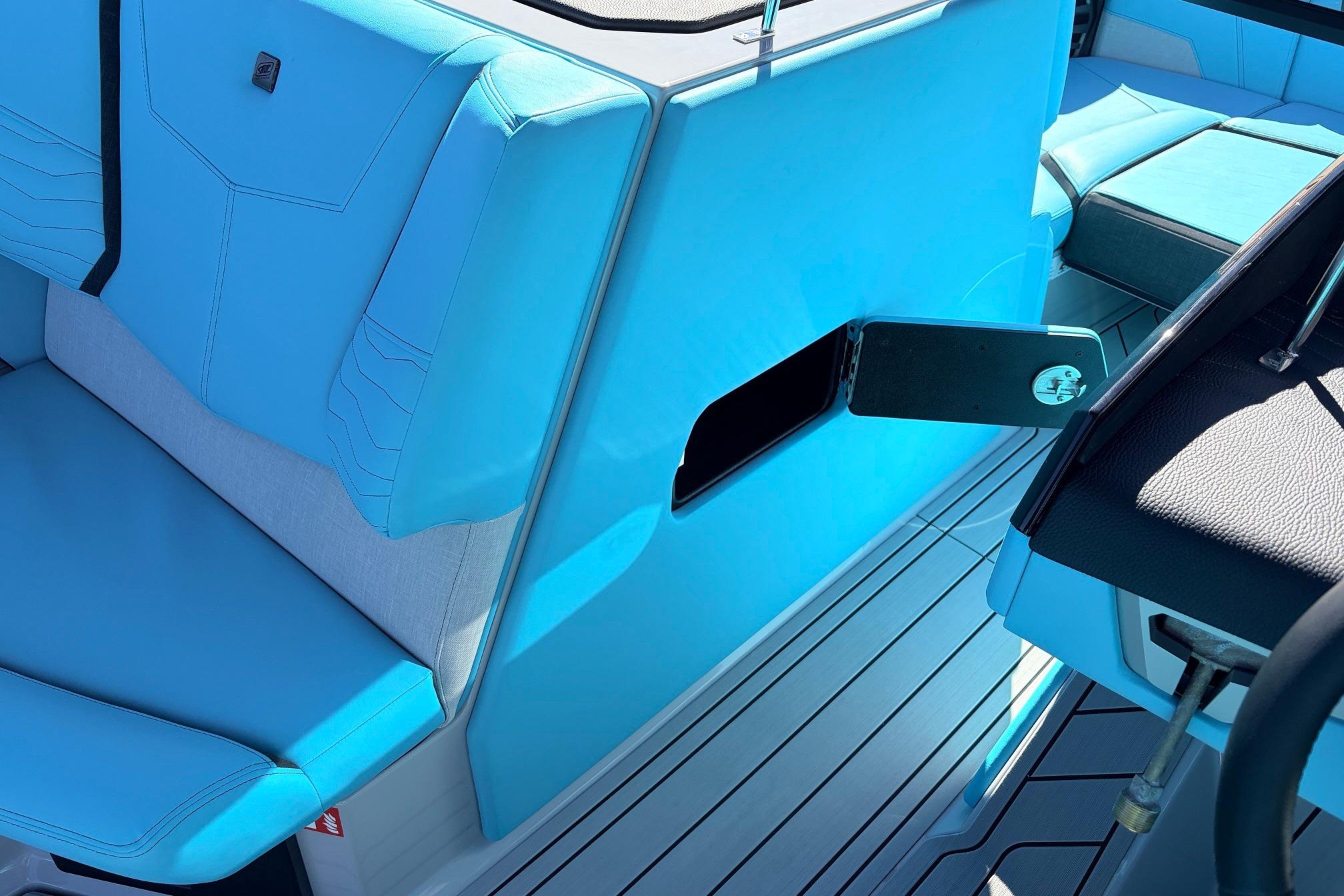 2026 Nautique Super Air Nautique G23 interior with blue seating and sleek design.