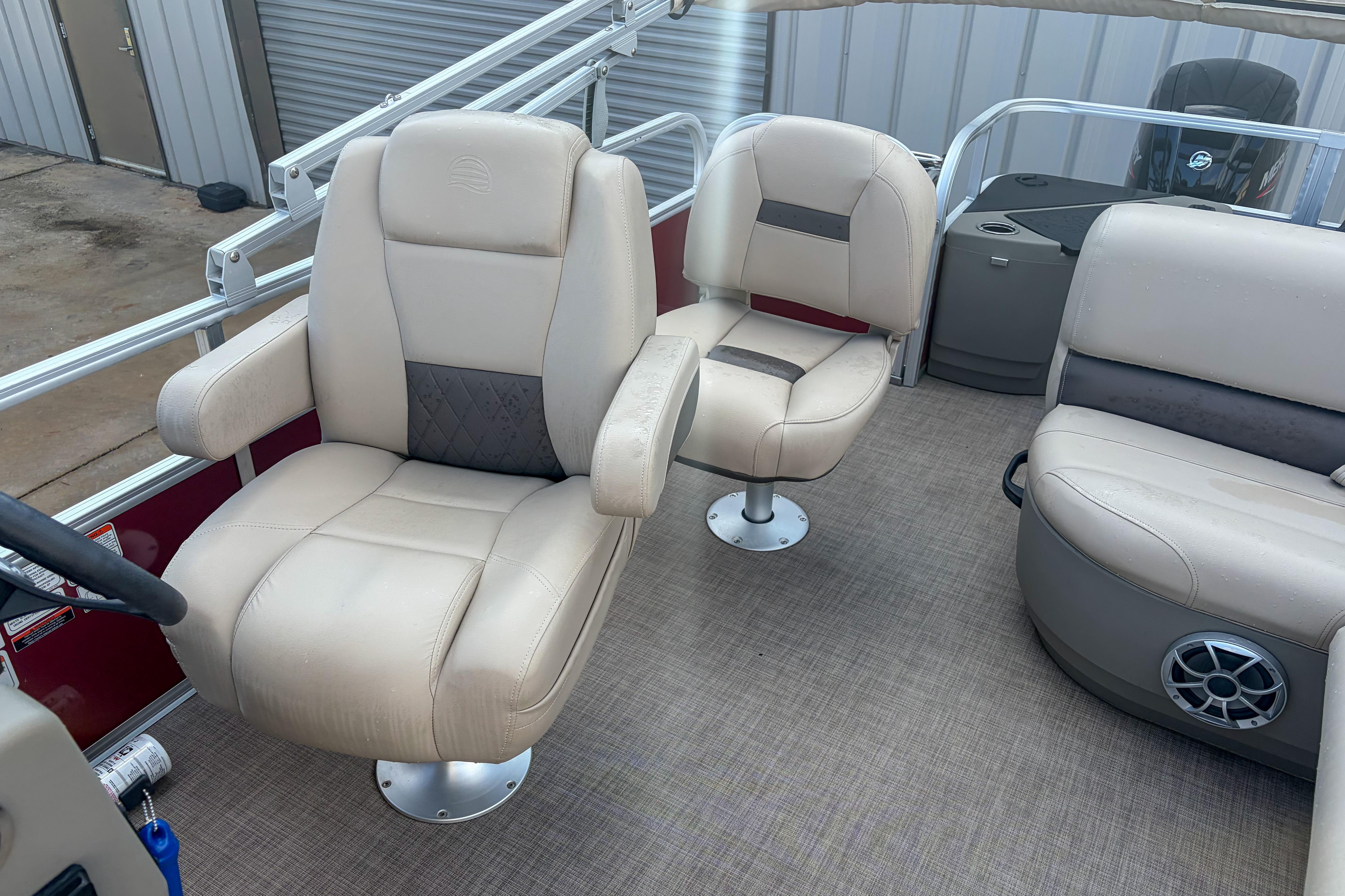 2024 Sun Tracker Bass Buggy 18 DLX interior with beige seating and modern design.