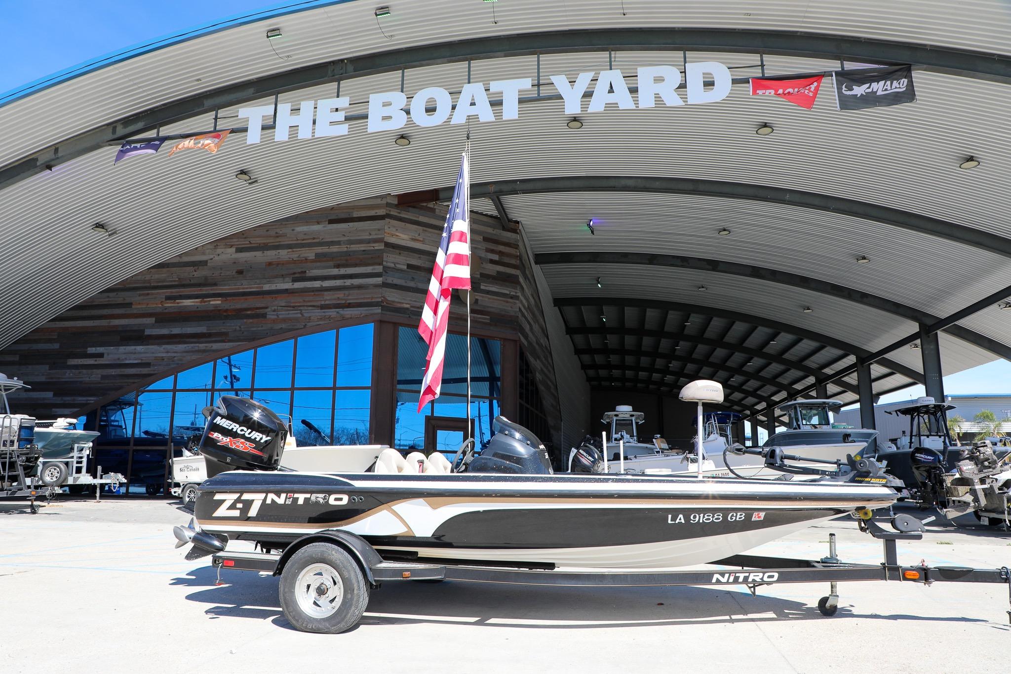 2013 Nitro Z-7 boat displayed at The Boat Yard with American flag.