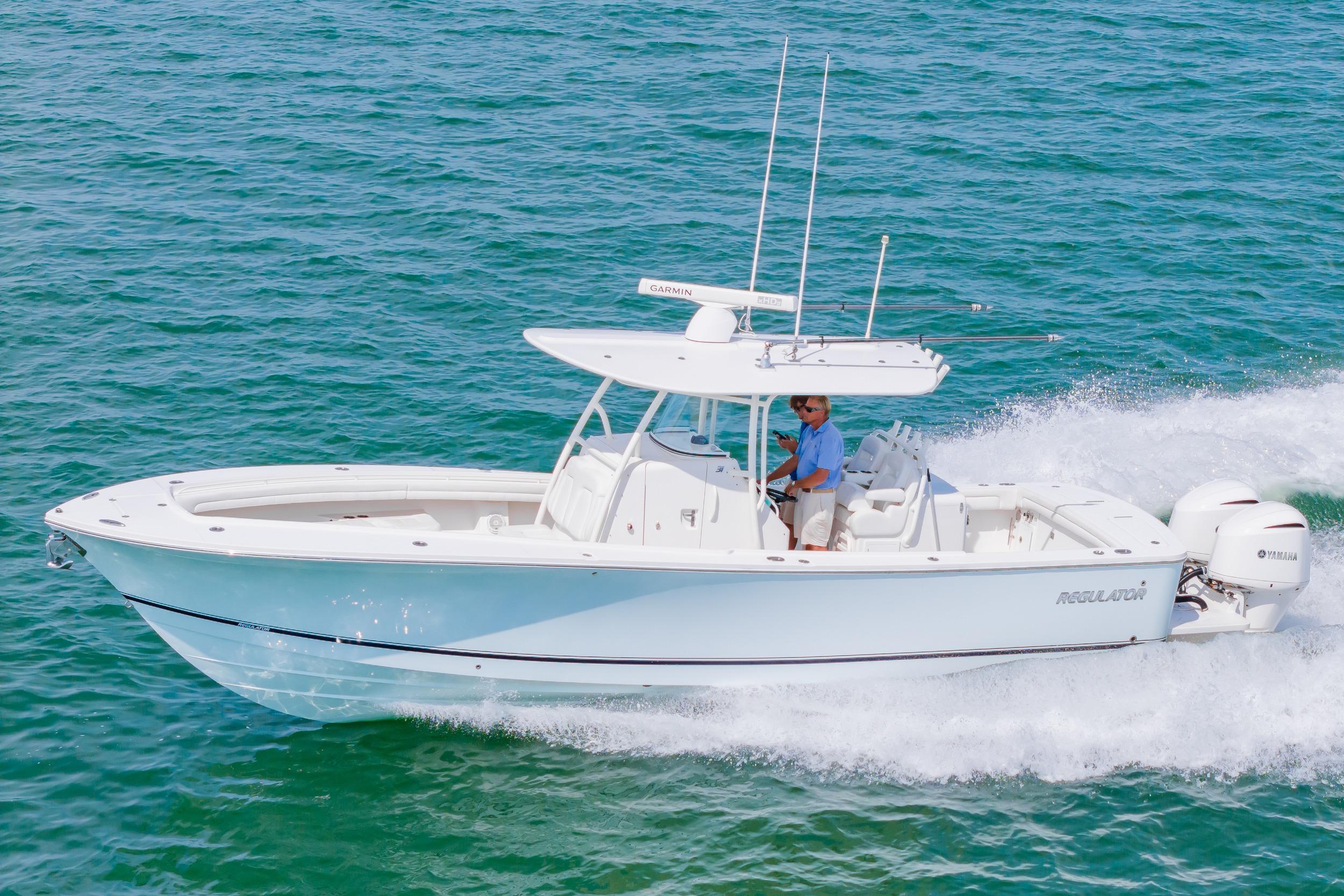 2019 Regulator 31 boat cruising on clear blue water.